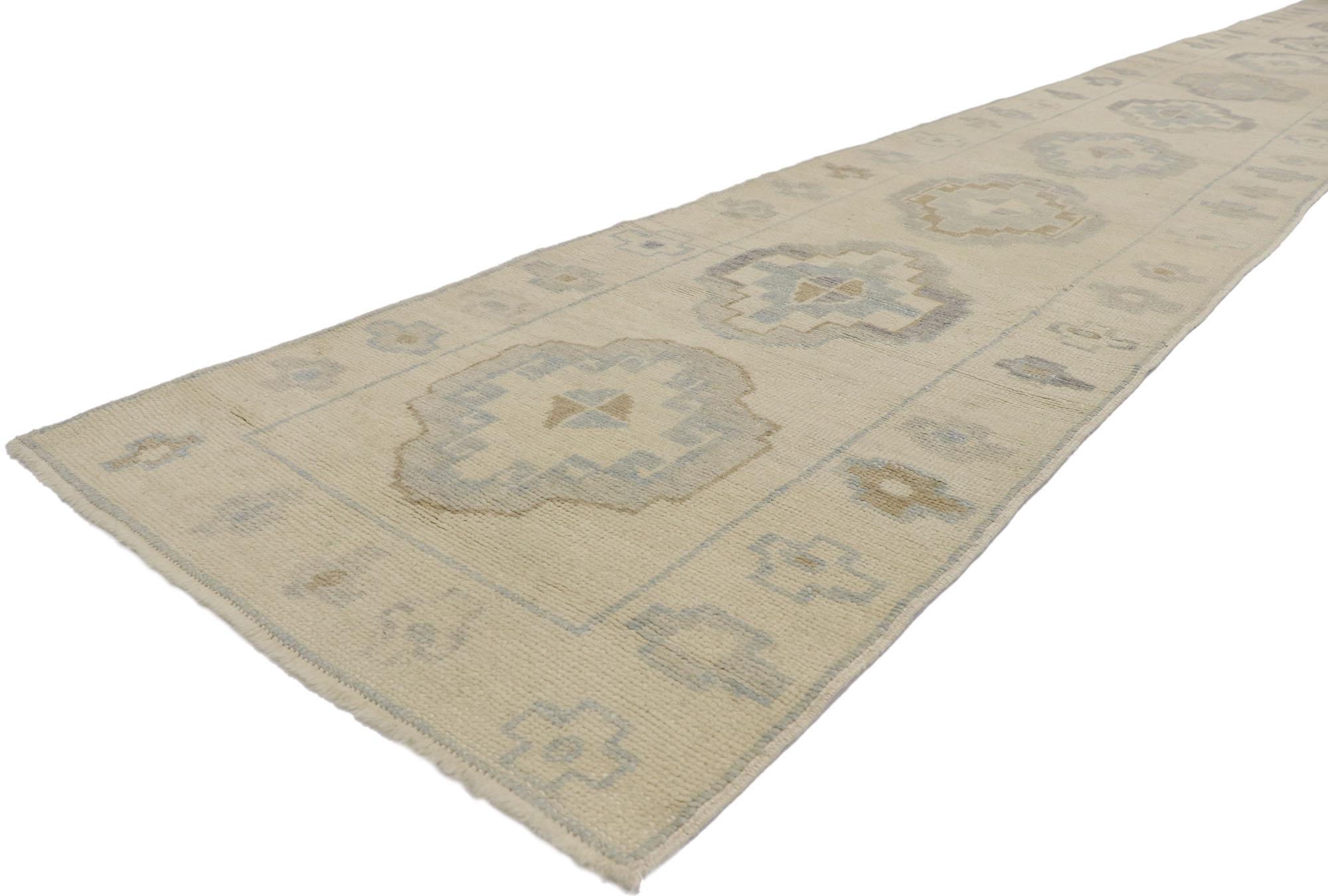 53589 New Contemporary Turkish Oushak Runner with Modern Style 02'09 x 21'01. This hand-knotted wool contemporary Turkish Oushak runner features an all-over geometric pattern spread across an abrashed oatmeal-beige striated field. An array of