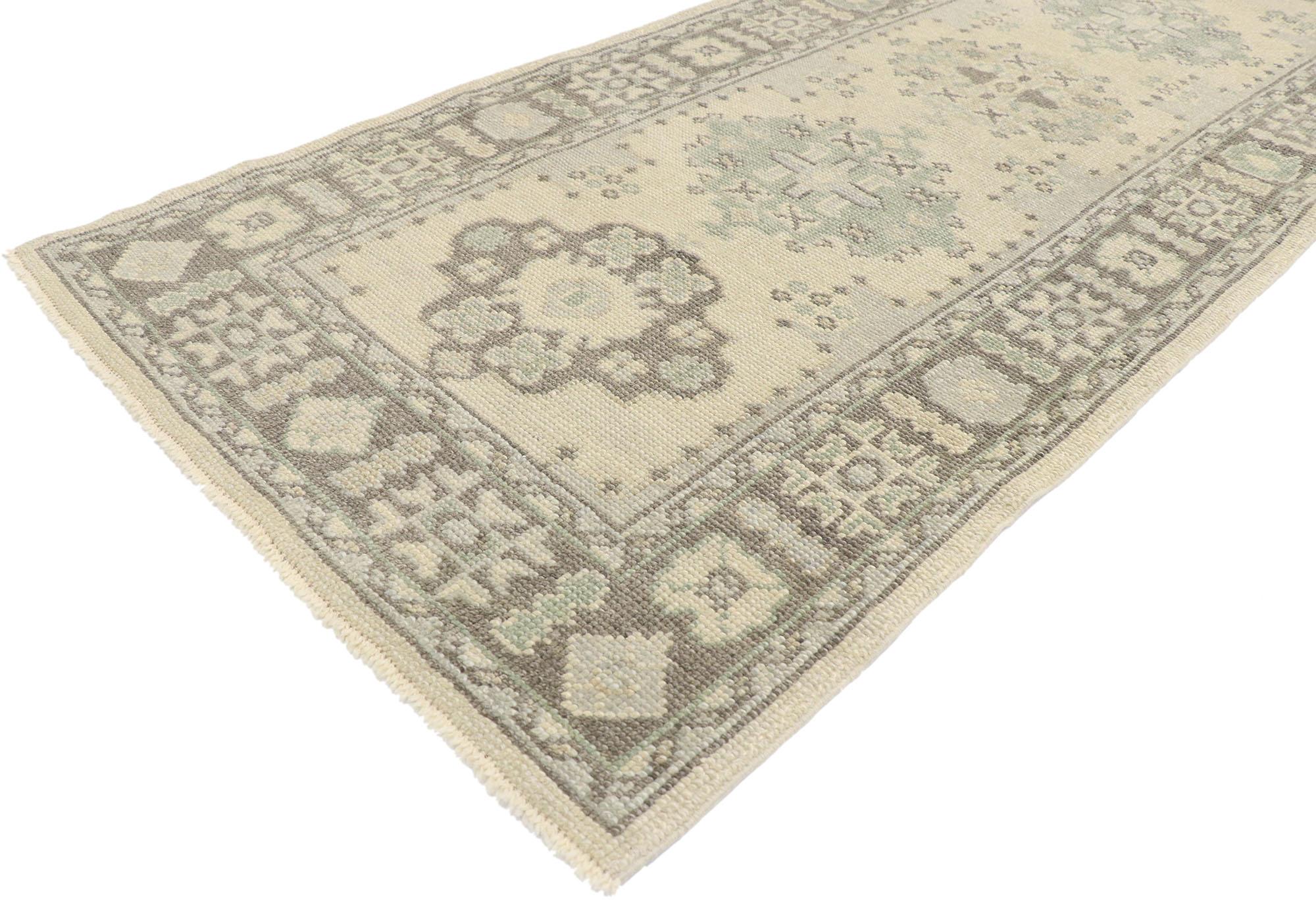 53544, new Contemporary Turkish Oushak runner with Modern Transitional style. Elegant simplicity meets modern style in this hand-knotted wool contemporary Turkish Oushak runner. The abrashed beige field features ornate medallions patterned with