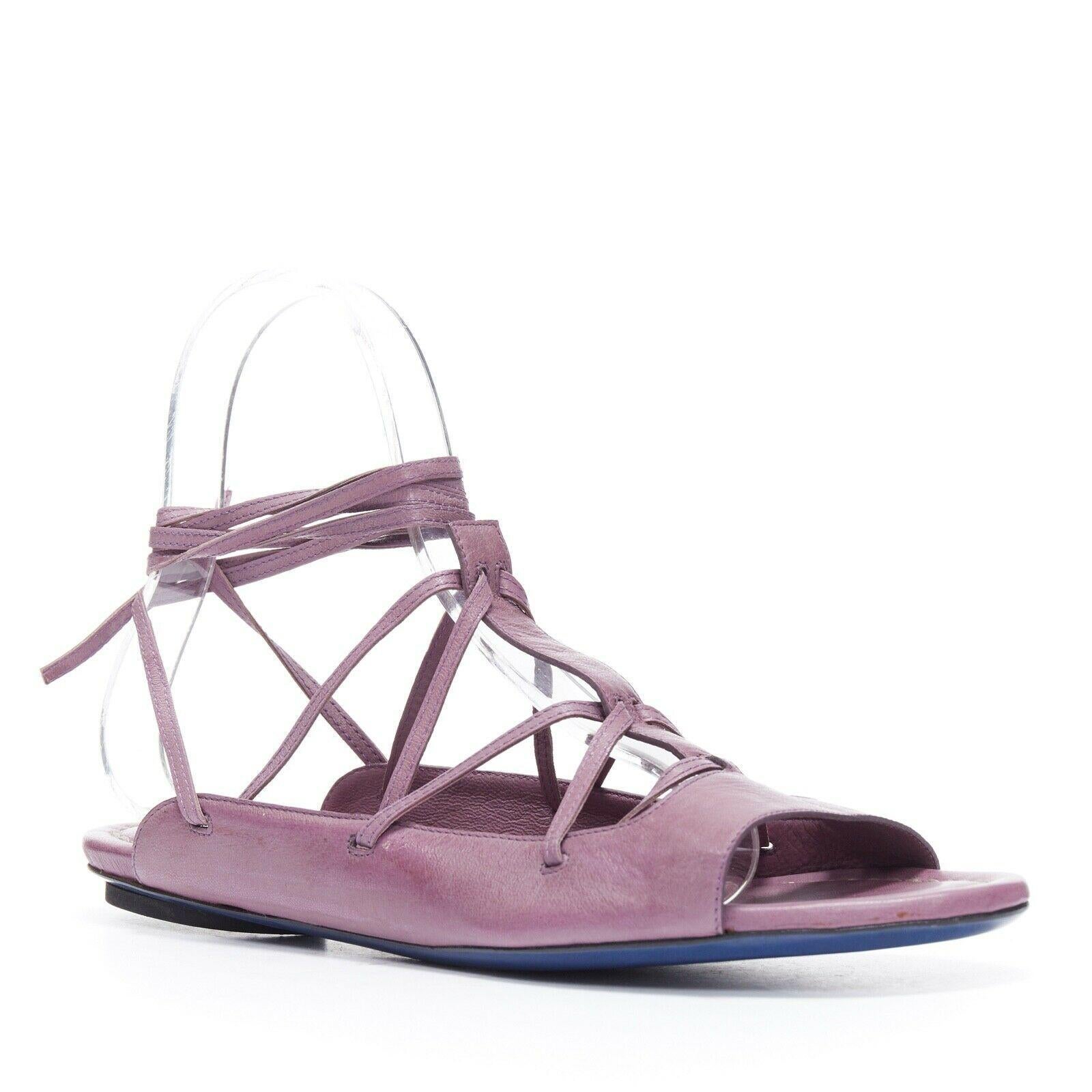 new COSTUME NATIONAL purple flat lace up wrap ankle flat sandals shoes EU39 US9
COSTUME NATIONAL
Purple leather upper. 
Lace up front. 
Wrap ankle detail. 
Open toe. 
Open heel. 
Leather sole. 
Made in Italy

CONDITION:
New with