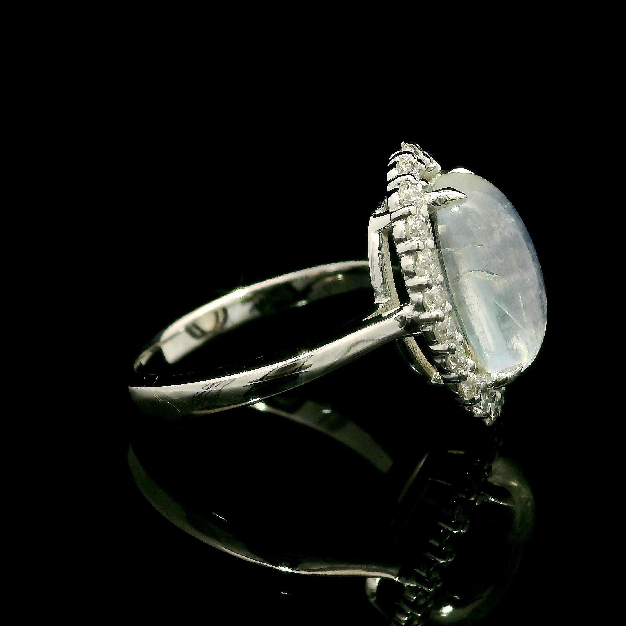 –Stone(s)–
(1) Natural Genuine Moonstone- Elongated Oval Cabochon Cut - Prong Set - Blue Color- 12.6x8mm - 3.78ct (exact) 
(22) Natural Genuine Diamond - Round Brilliant Cut - Prong Set - F/G Color - VS1/VS2 Clarity - 0.53ctw (exact)
Total Carat