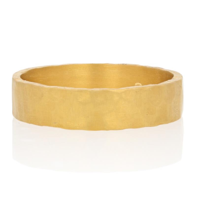 This custom-made ring is created in 24k yellow gold and displays a hammered finish.

This ring is a size 12 1/4, but it can be re-sized up or down 1 size for a $40 fee. Once a ring is re-sized, we guarantee the work but we are unable to offer a