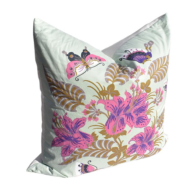 Very large square shape pillow custom made from a vintage Jim Thompson scarf with pink and purple flowers, butterflies and leaves on a mint background. The back is in a complimentary cream color linen with zipper closure. Custom made down fill