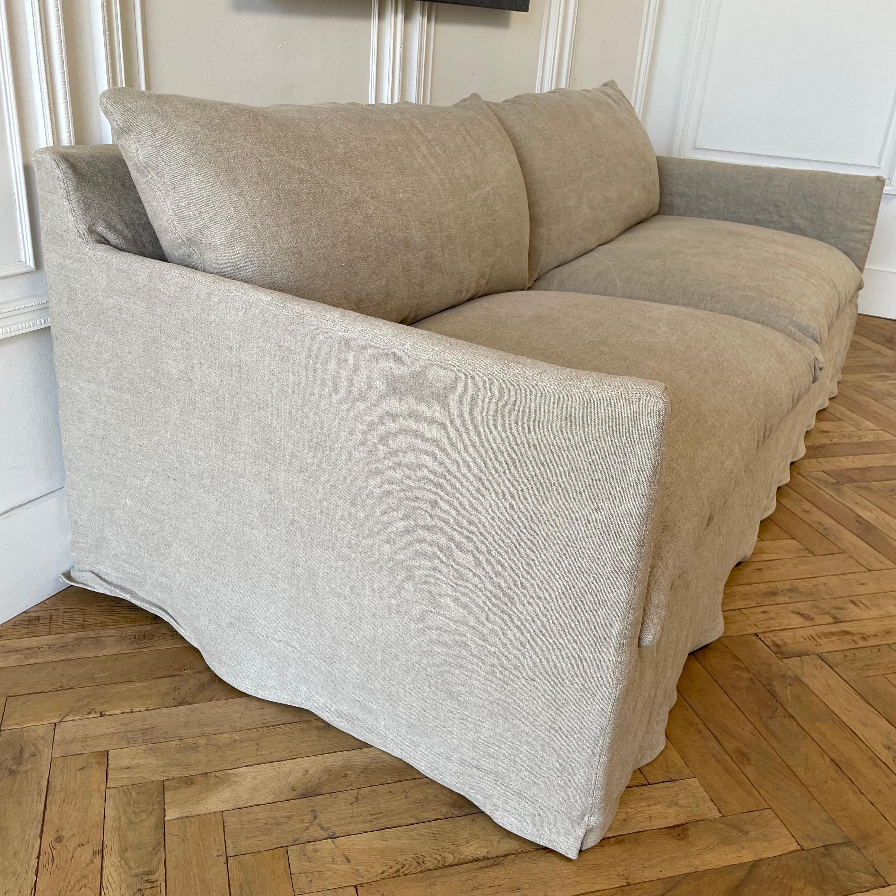 Custom Made Linen Slip Covered Sofa
Fabric: 100% Irish linen in Flax with a Stone Washed Finish
Weight 20oz. linen
Prewashed, Soft Finish
Down Style Seats and Backs, removable slip cover, dry clean recommended.
Saddle stitch cushions and backs. 