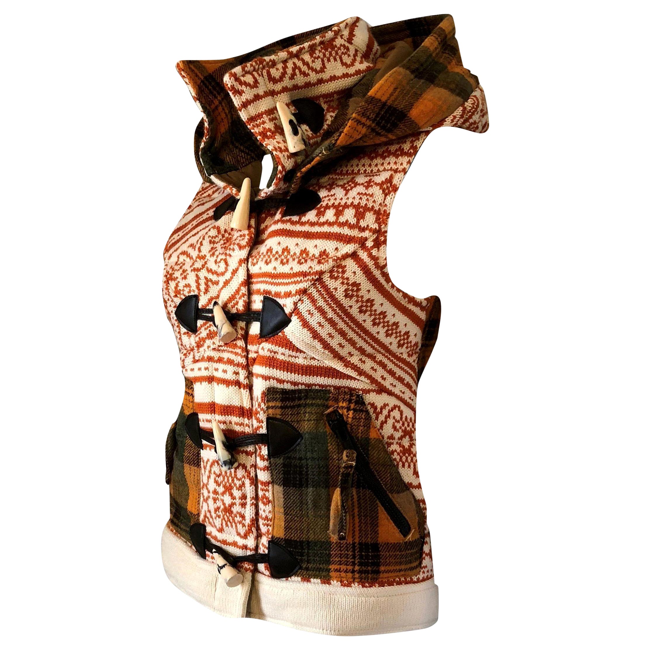 Da-Nang Knit Vest
Brand New w/ Tags
$486
Size: Small
* Removable Hood
* Toggle Front Closure
* Side Pockets & Zippered Compartments 

* Fabric Front: 30% Wool 70% Acrylic
* Fabric Back: 30% Wool, 40% Poly, 30% Acrylic