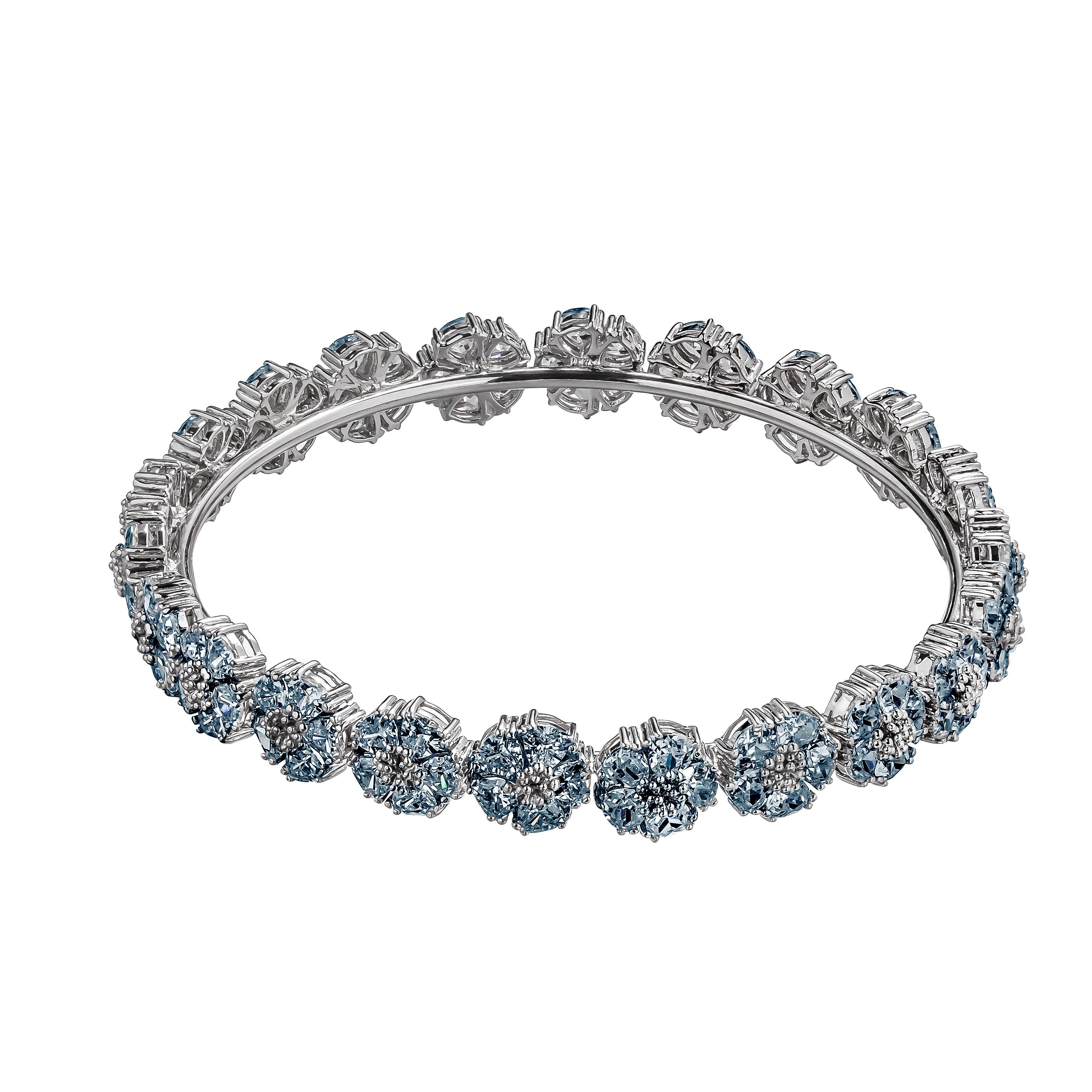 Designed in NYC

.925 Sterling Silver 10 x 10 mm Dark Blue Topaz Blossom Gemstone Wraparound Bracelet.  No matter the season, allow natural beauty to surround you wherever you go. Blossom gemstone wraparound bracelet: 

Sterling silver