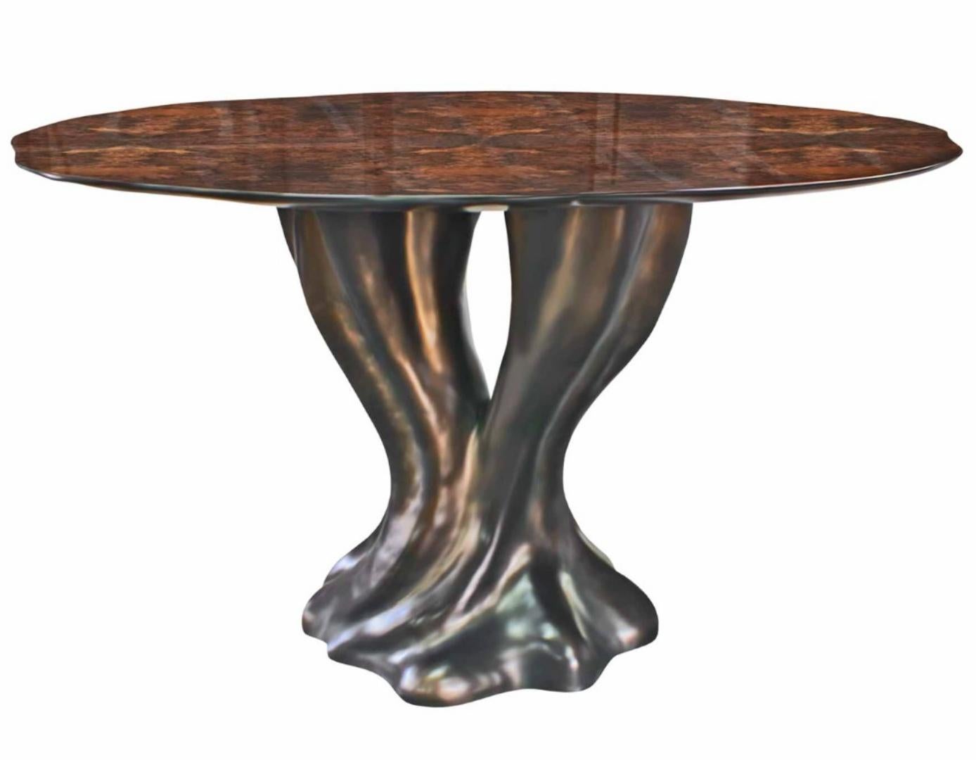 Dining table

General information

Dimensions (cm): Ø120 x 75
Dimensions (in): Ø47.2 x 29.5
Seats: 4 a 6

Materials and colors

Top: Wood with walnut root veneer, with high gloss finish;
Base: Resin reinforced with fiberglass finished in bronze