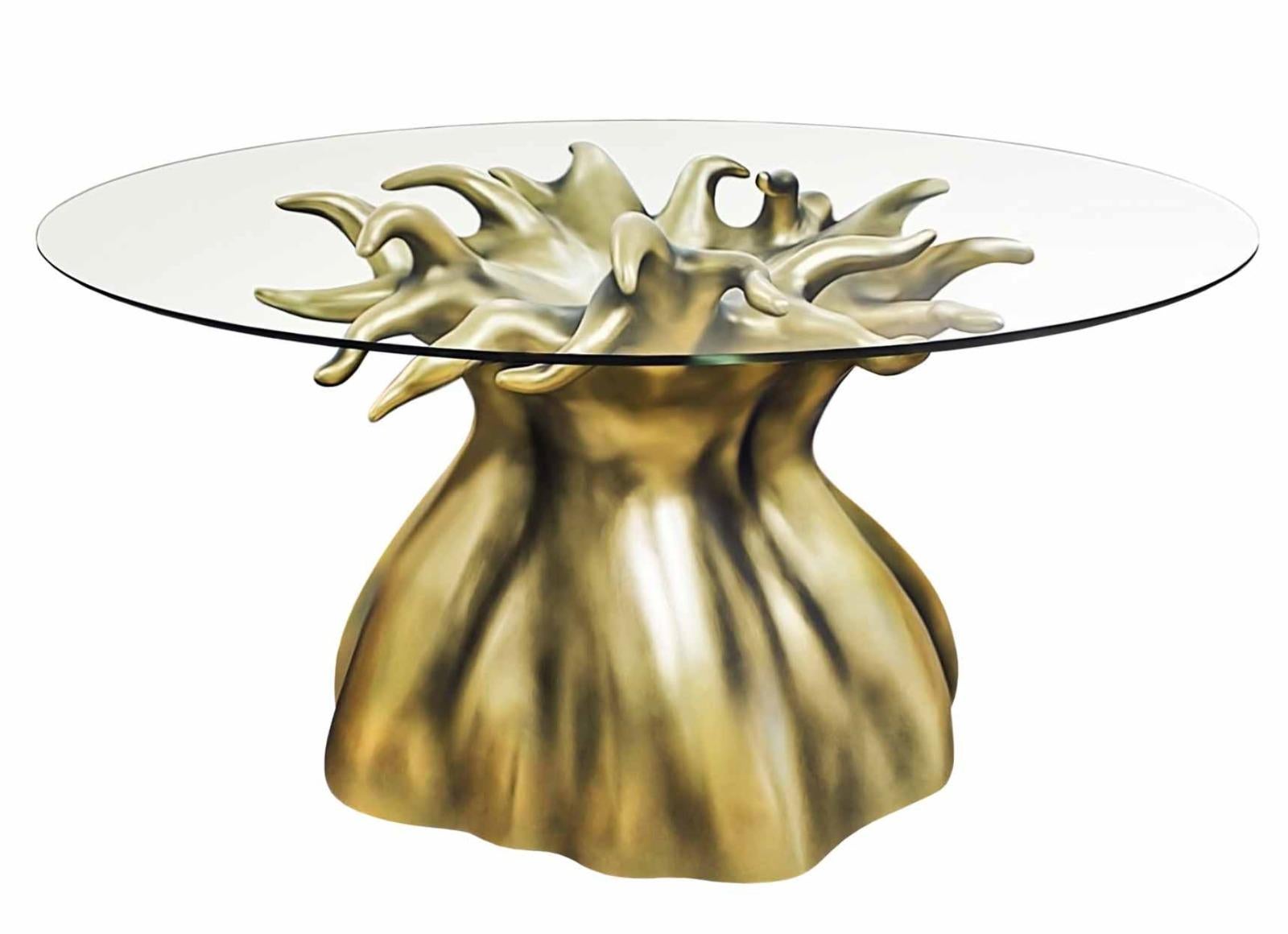 Dining table

General information
Dimensions (cm): Ø160 x 75
Dimensions (in): Ø63 x 29.5
Seats: 8

Materials and colors
Top: Clear tempered glass 12 mm thick, with polished edge;
Base: Resin reinforced with fiberglass finished in aged gold