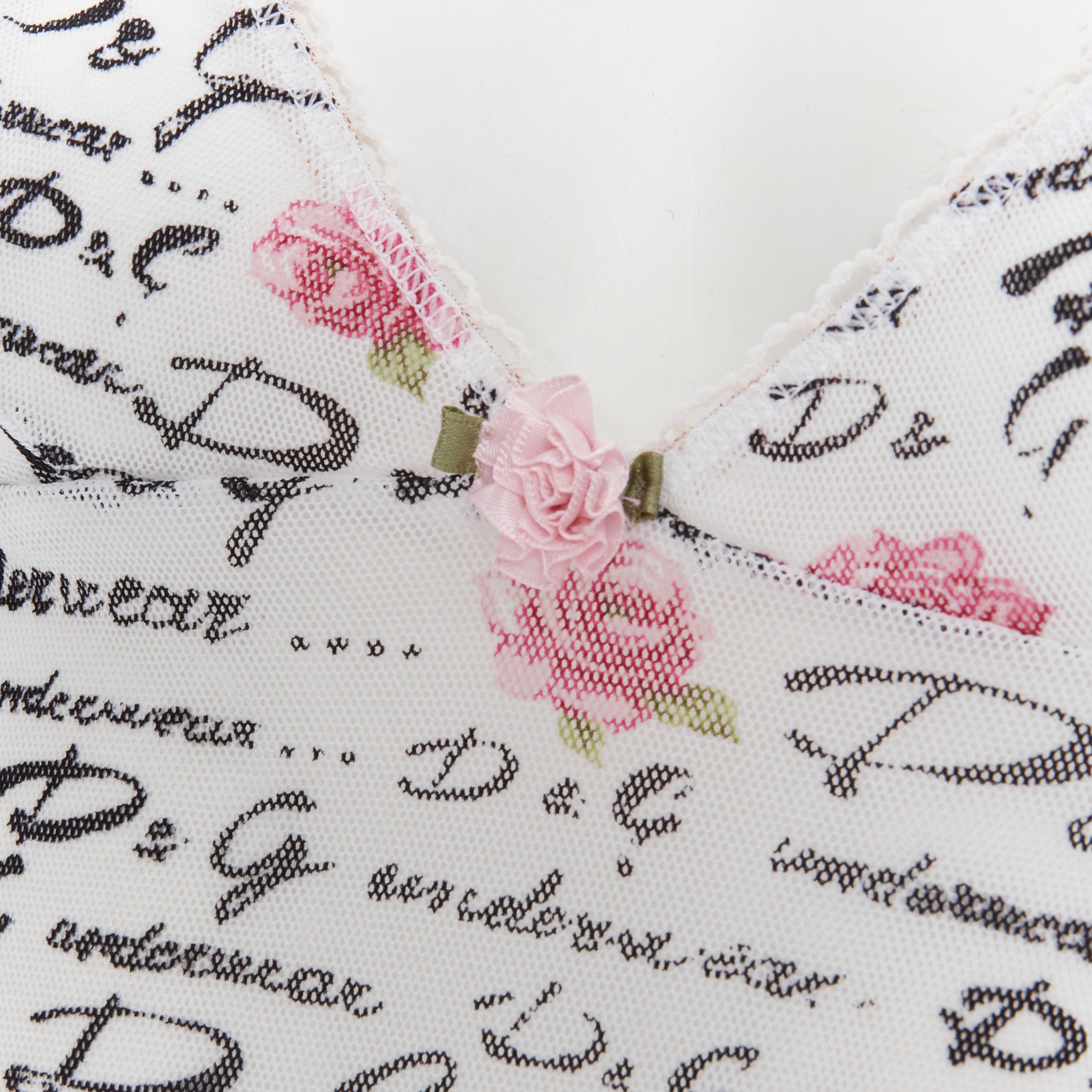 new D&G DOLCE GABBANA Underwear white logo rose mesh lace trim cami tank top M 
Reference: TGAS/B01450 
Brand: Dolce Gabbana 
Material: Mesh 
Color: White 
Pattern: Floral 
Extra Detail: Rose bud detail at neckline. Lace trimming. Adjustable strap.