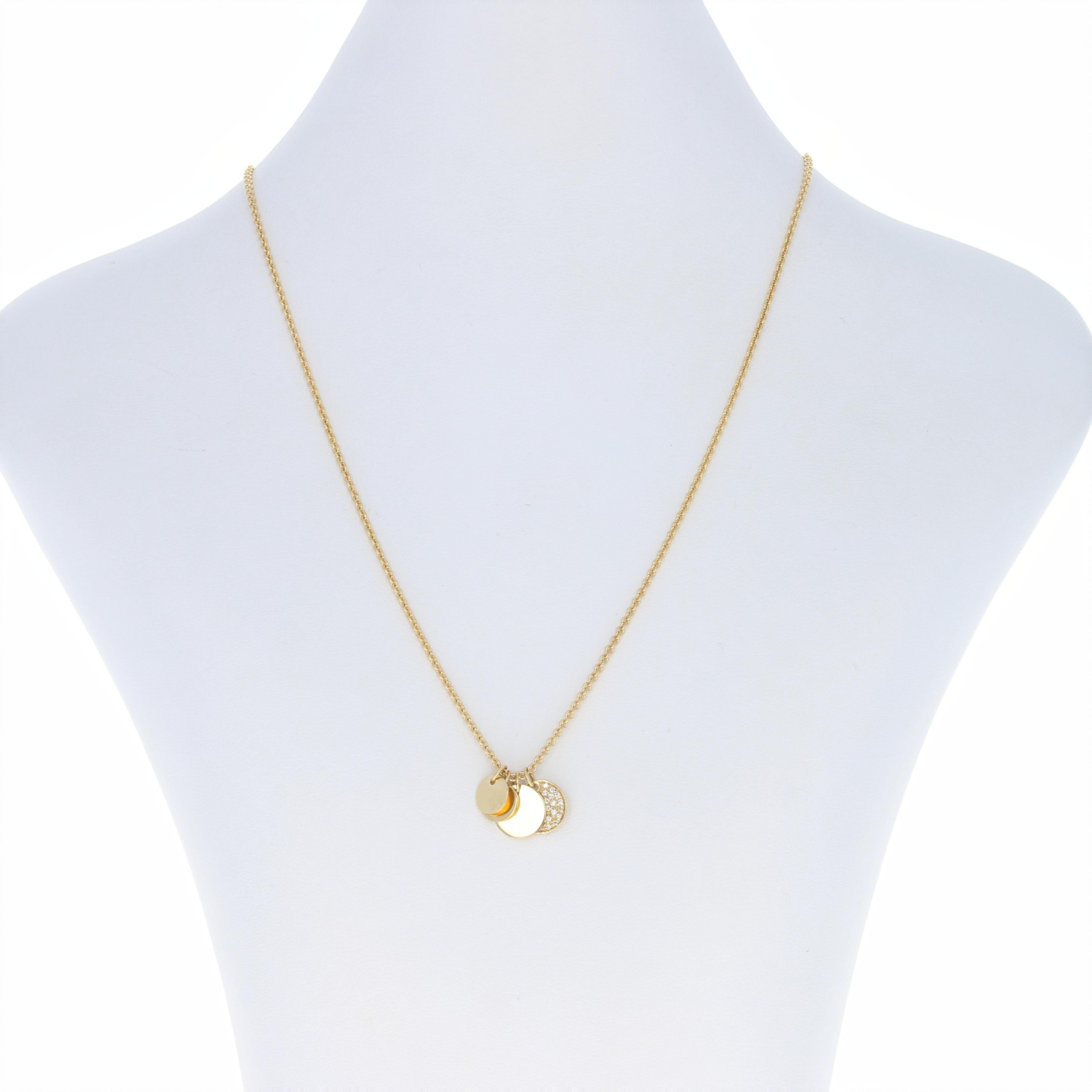 Surprise the special woman in your life with a sweet token of your love! Crafted in high purity 18k yellow gold, this NEW cable chain necklace is graced by a sparkling diamond-accented diamond disc pendant which is accompanied by a luminous trio of