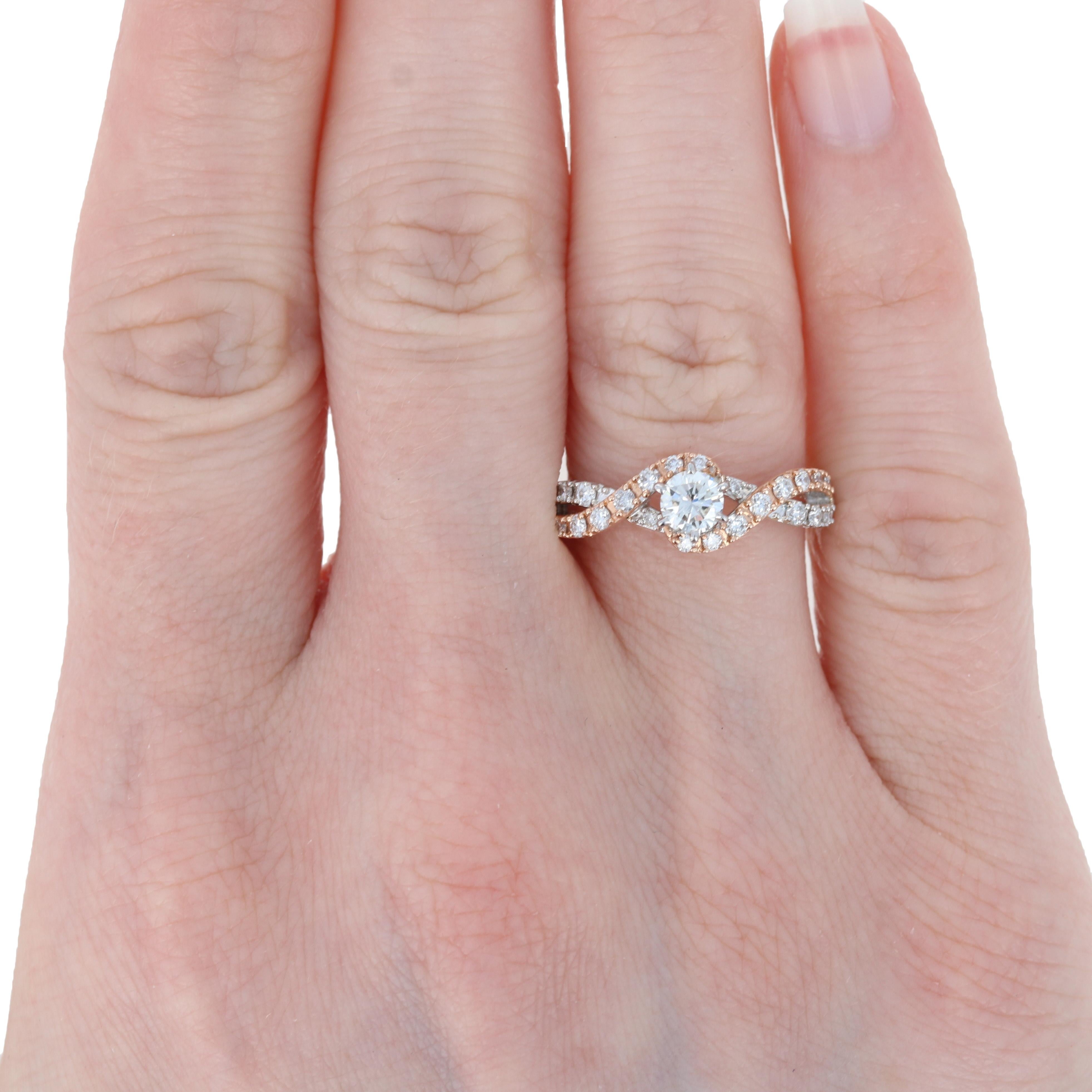 You've met the woman of your dreams. Now make her dreams come true when you propose with this exquisite engagement ring! Fashioned in 14k white gold with accents of 14k rose gold, this NEW piece features a medley of natural diamonds. The centerpiece