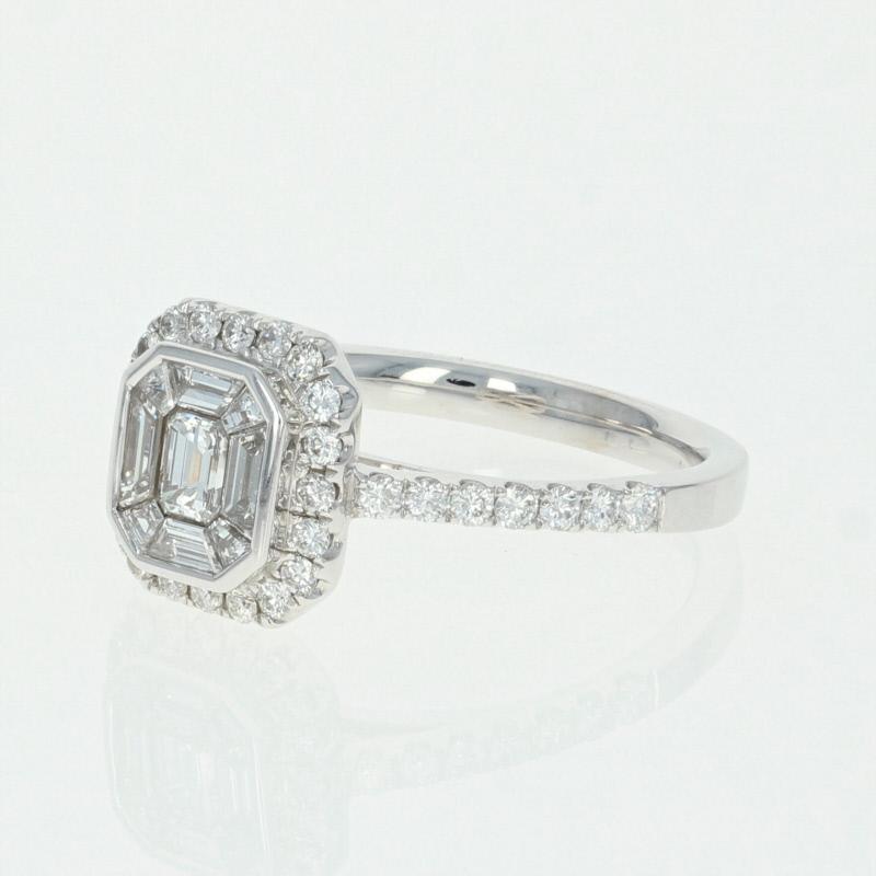 Dazzle the love of your life with a ring she will cherish forever! This NEW 14k white gold piece showcases emerald cut and trapezoid baguette cut diamonds set in the center of the ring’s face to form a mesmerizing illusion solitaire design which is