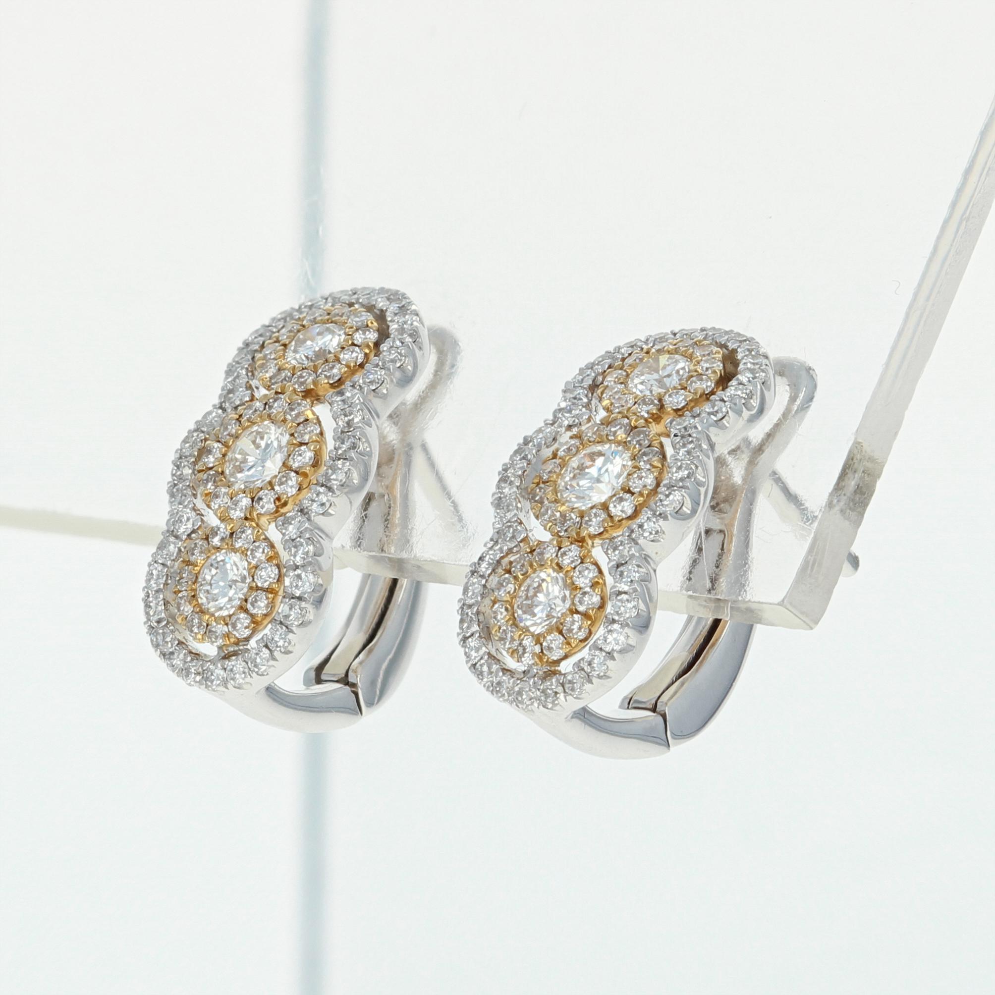 With the radiant gift of diamonds, you say it all without saying a word! Exquisitely crafted in 14k white and yellow gold, this NEW pair of curved J-hoop earrings feature three sparkling diamonds which are each encircled by diamond haloes and