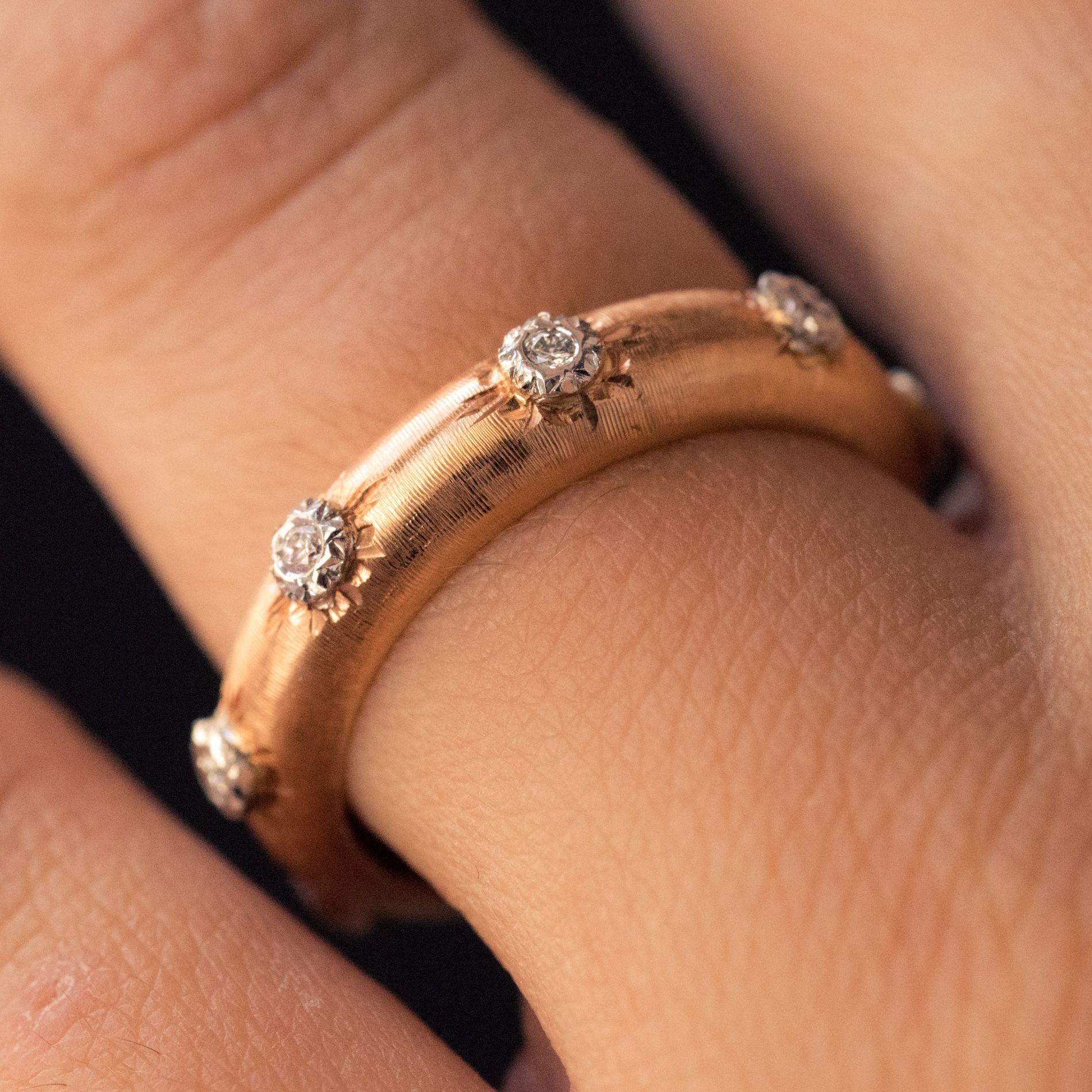 Ring in 18 carat rose gold.
This delightful rounded brushed rose gold ring is engraved and set with 7 brilliant- cut diamonds. This diamond ring would make an excellent eternity ring. 
Total weight of diamonds : 0.10 carats approximately 
Width :