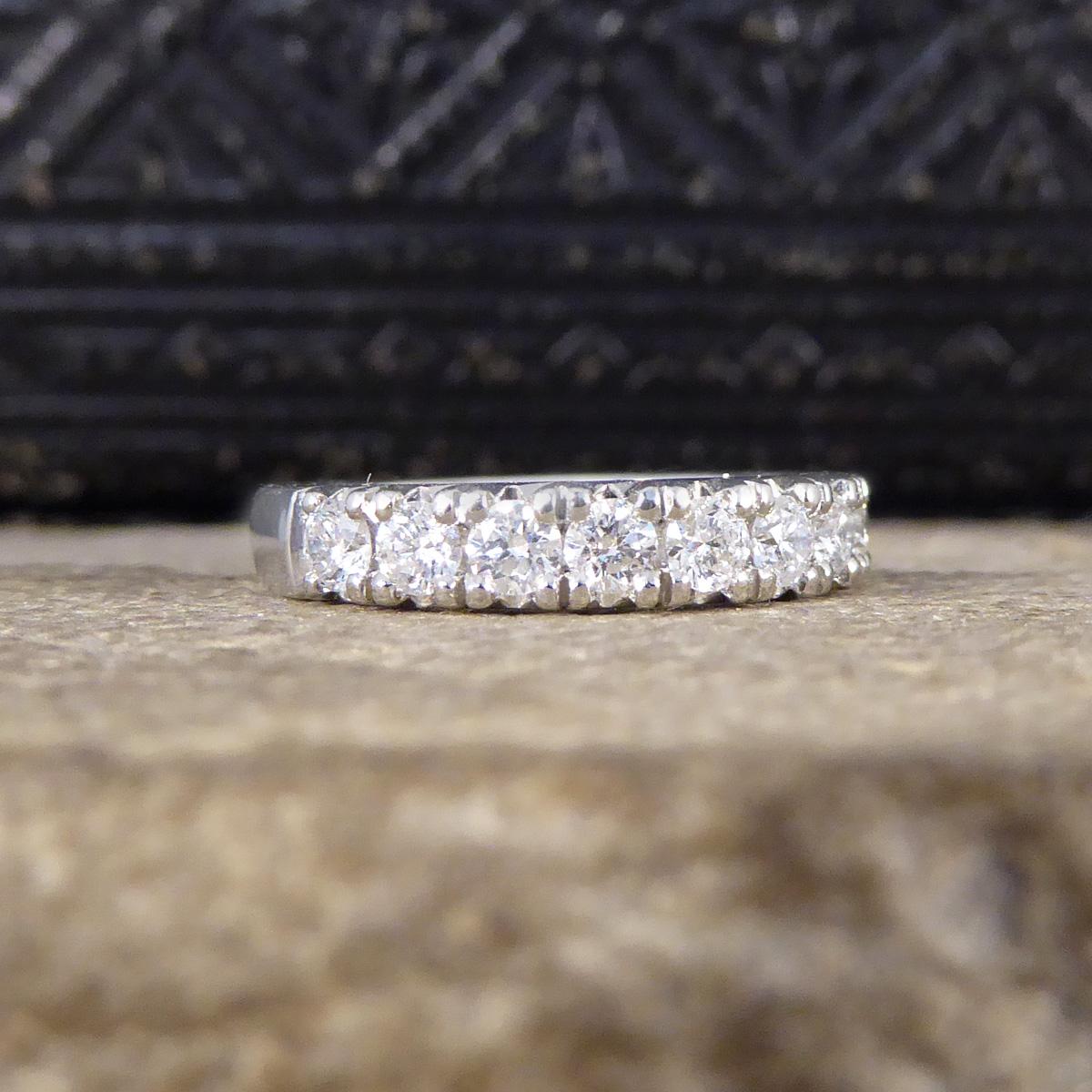 This ring is new and never worn. It features 11 Modern Brilliant Diamonds all of equal size sat next to each other along the head of the ring reached just slightly past half way making it more than half an eternity. It has a great eternity ring feel
