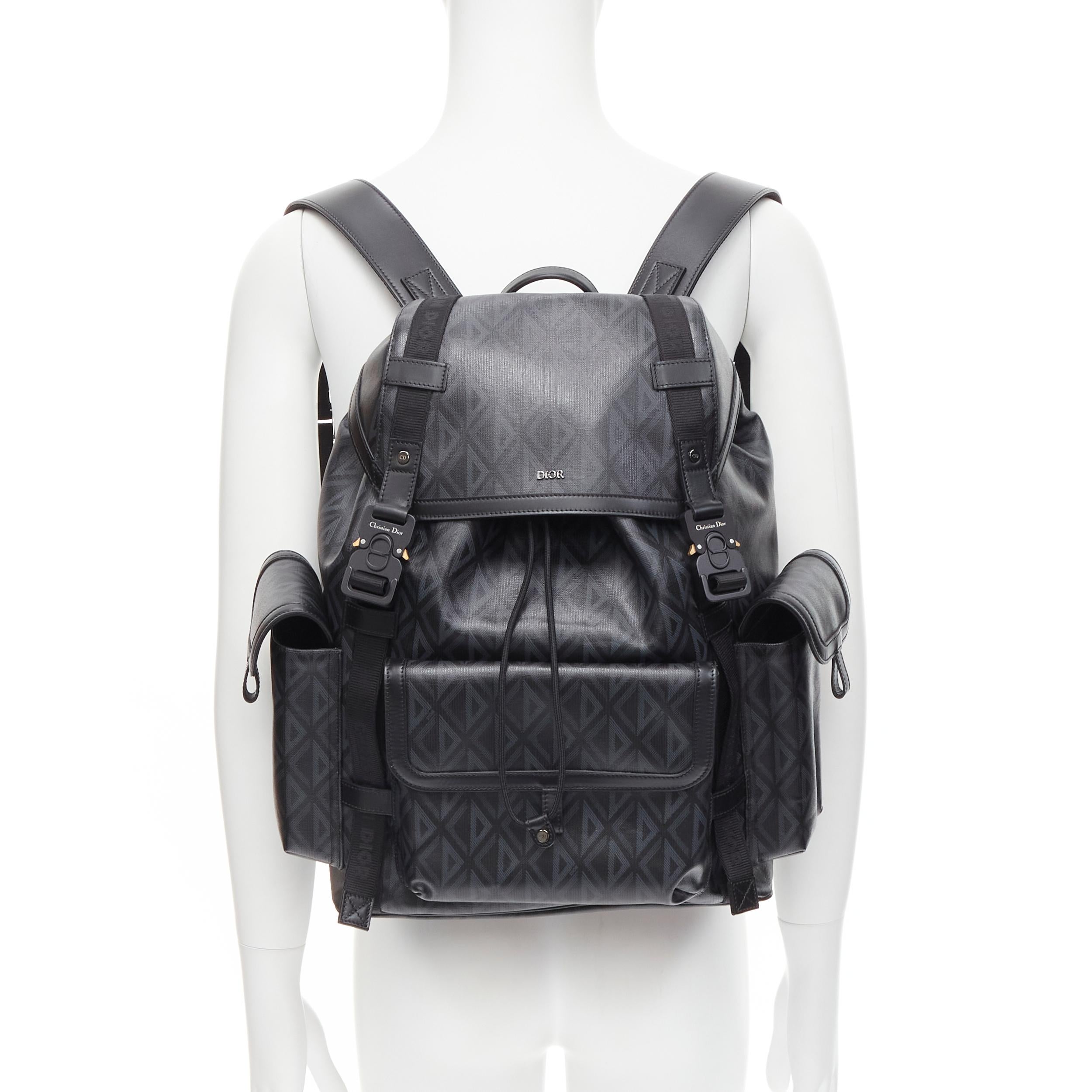 new DIOR 2022 HIt The Road black CD Diamond canvas logo backpack 
Reference: JOMK/A00066 
Brand: Dior 
Designer: Kim Jones 
Collection: HIt The Road Runway 
As seen on: Travis Scott 
Material: Canvas 
Color: Black 
Pattern: Solid 
Closure: Buckle