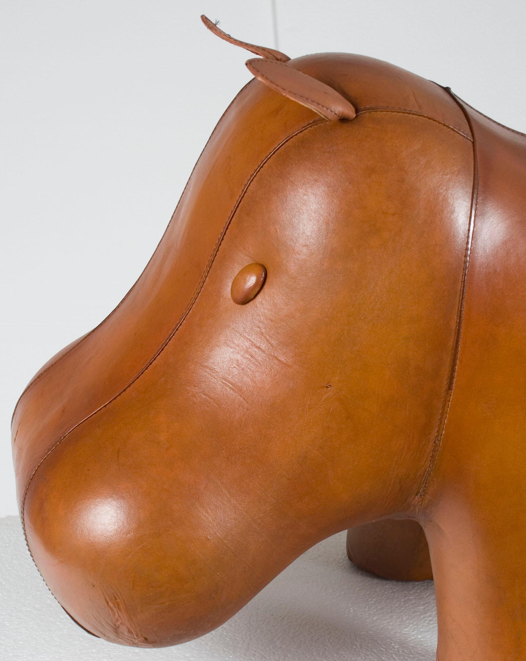 This incredibly quaint footstool is made in the shape of a hippo out of beautiful brown leather. It makes a sturdy footstool and beautiful piece of decor for your home. Newly handmade in England, the superb quality is on par with other English