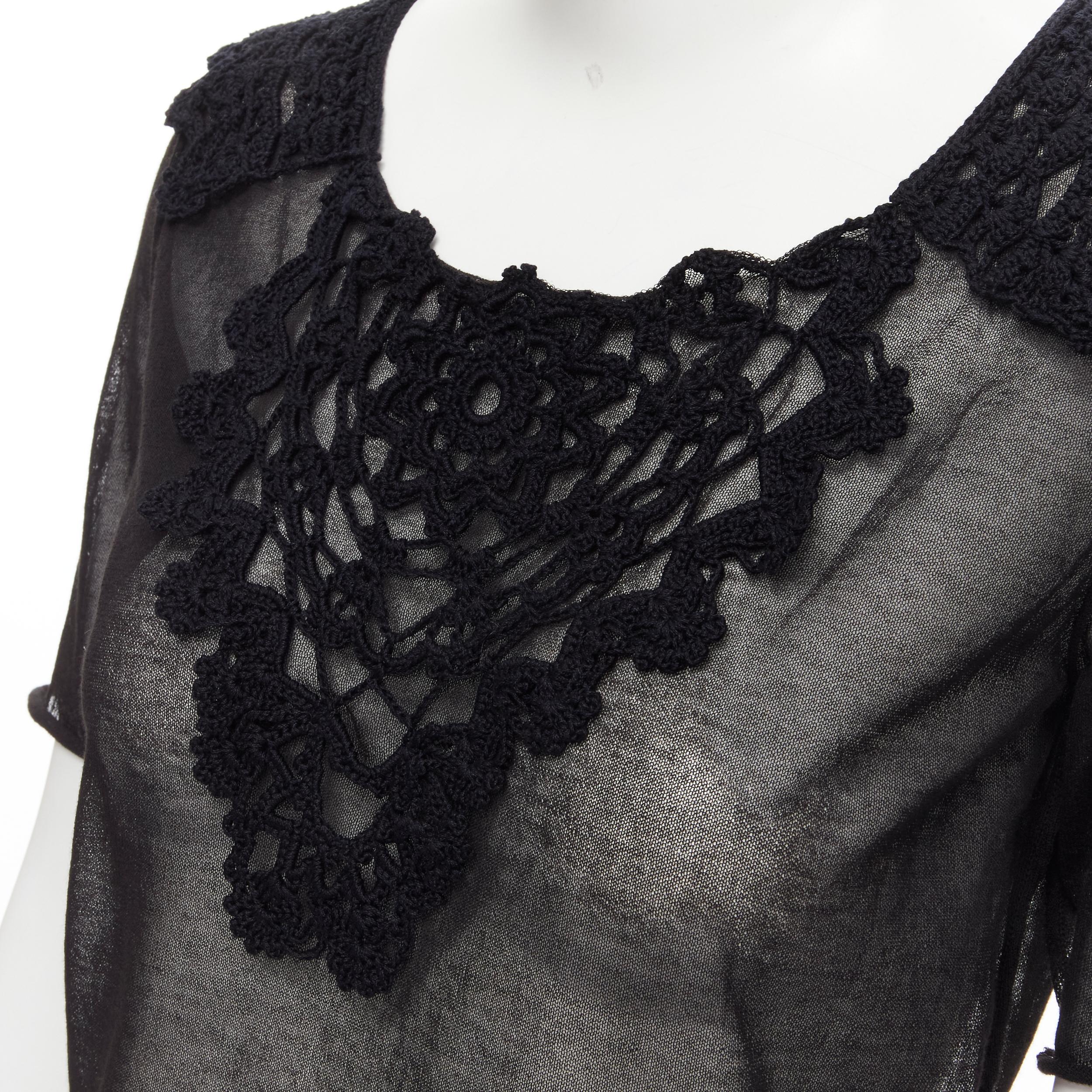 new DOLCE GABBANA crochet lace sheer rolled edges fine knit cotton top IT40 S 
Reference: MELK/A00041 
Brand: Dolce Gabbana 
Material: Cotton 
Color: Black 
Pattern: Solid 
Extra Detail: Crochet detailing at collar. Round neck. Rolled edges. 
Made