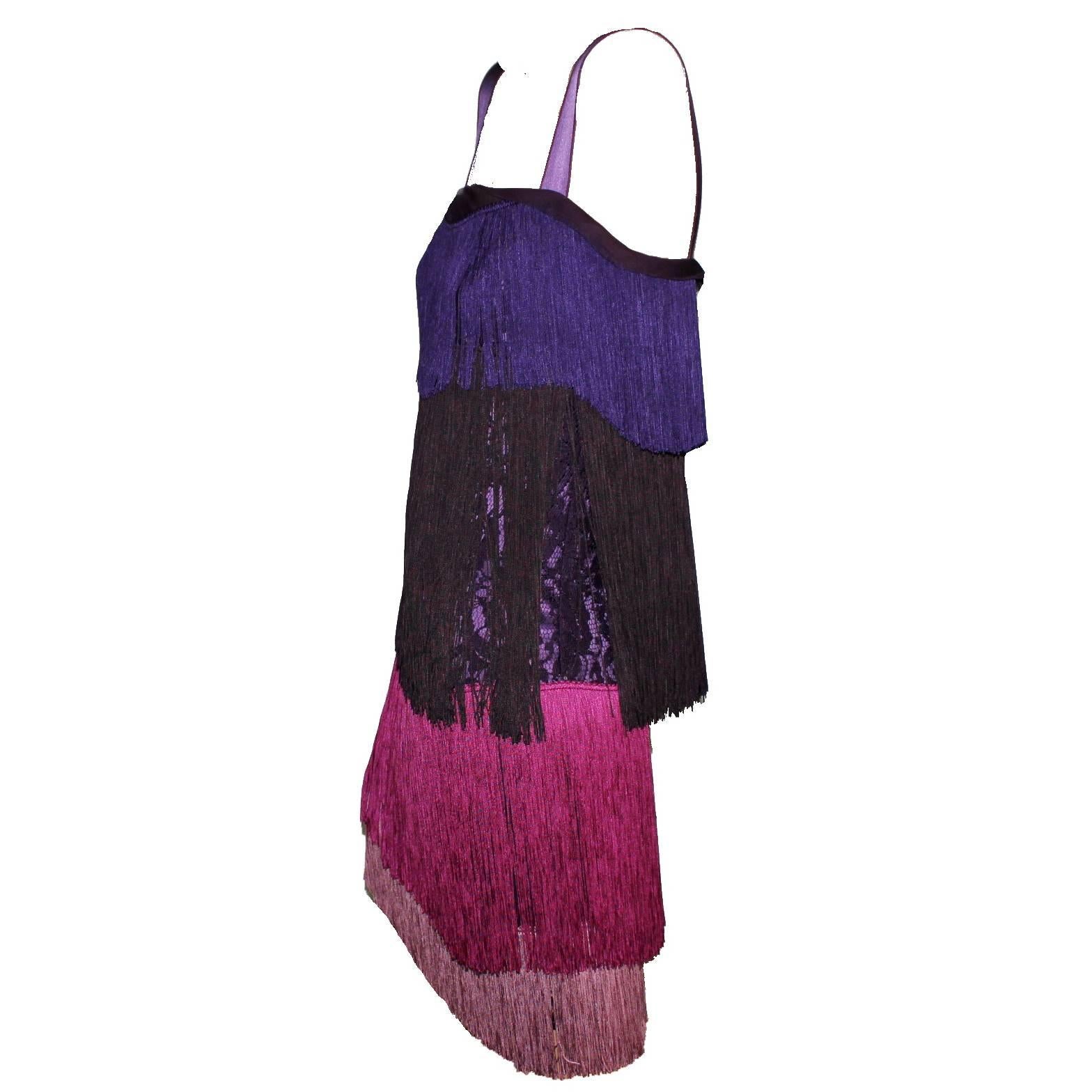 GORGEOUS DOLCE & GABBANA SILK FRINGE  DRESS

FLAPPER DRESS AS FROM THE MOVIE THE GREAT GATSBY



Made out of a purple lace fabric that shines through the fringes
Purple underdress
Colorblock fringes
Size 40
Condition: Brandnew with tags
Retail price