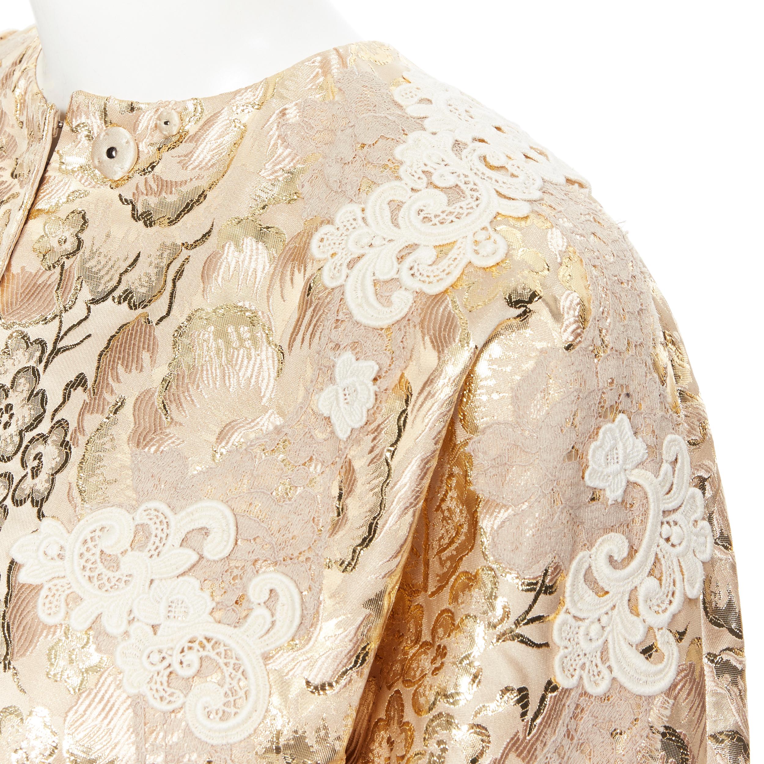 new DOLCE GABBANA metallic gold lace applique floral brocade jacket IT36 XS
Brand: Dolce Gabbana
Designer: Dolce Gabbana
Model Name / Style: Jacquard jacket
Material: Polyester, silk
Color: Gold
Pattern: Floral
Closure: Button
Extra Detail: Snap