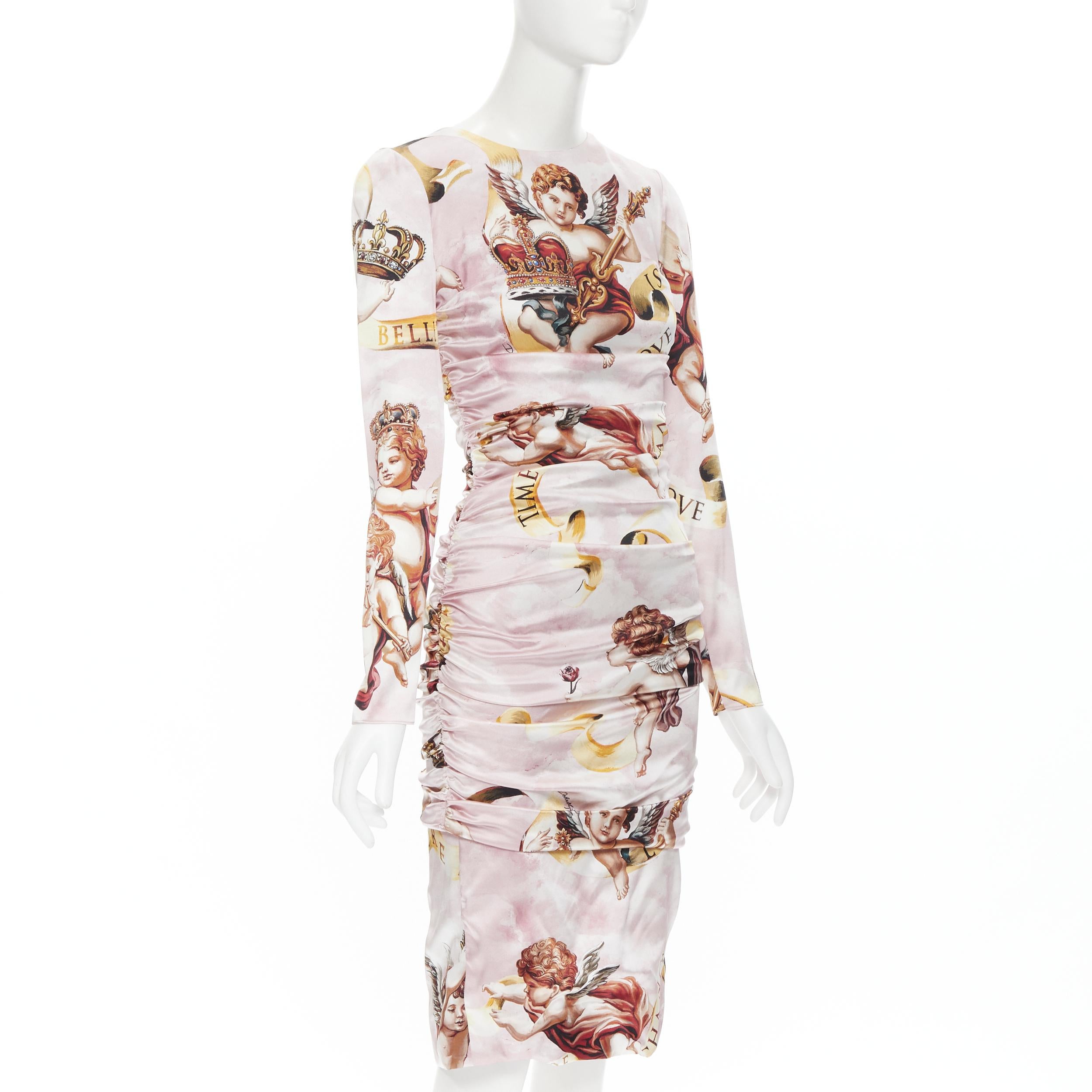 new DOLCE GABBANA Runway pink Cherub angel print ruched body con dress IT40 Reference: TGAS/B01378 
Brand: Dolce Gabbana 
Material: Silk 
Color: Pink 
Pattern: Abstract 
Closure: Zip 
Extra Detail: Stretch ruched sides. Gathered draping. Zip back