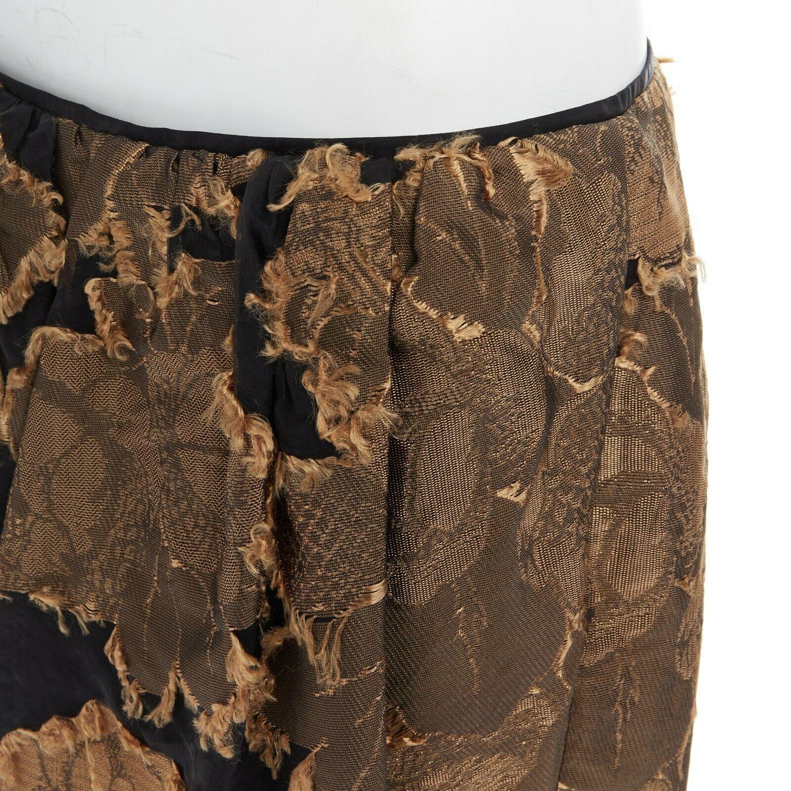 new DRIES VAN NOTEN gold black oriental floral raw jacquard gauze skirt FR42 XL

DRIES VAN NOTEN
FROM THE SPRING SUMMER 2015 COLLECTION
Simoni Skirt . Acetate, polyester, silk . Black polyester base with gold jacquard overlay . 
Oriental gold floral