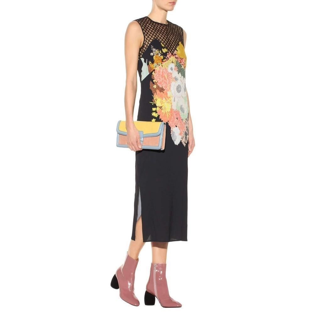 Crated from black crêpe, Dries Van Noten's sleeveless dress features netted panelling along the décolletage for an intriguing combination of flirty skin and demure coverage. The design features the designer's distinctive and colourful floral print