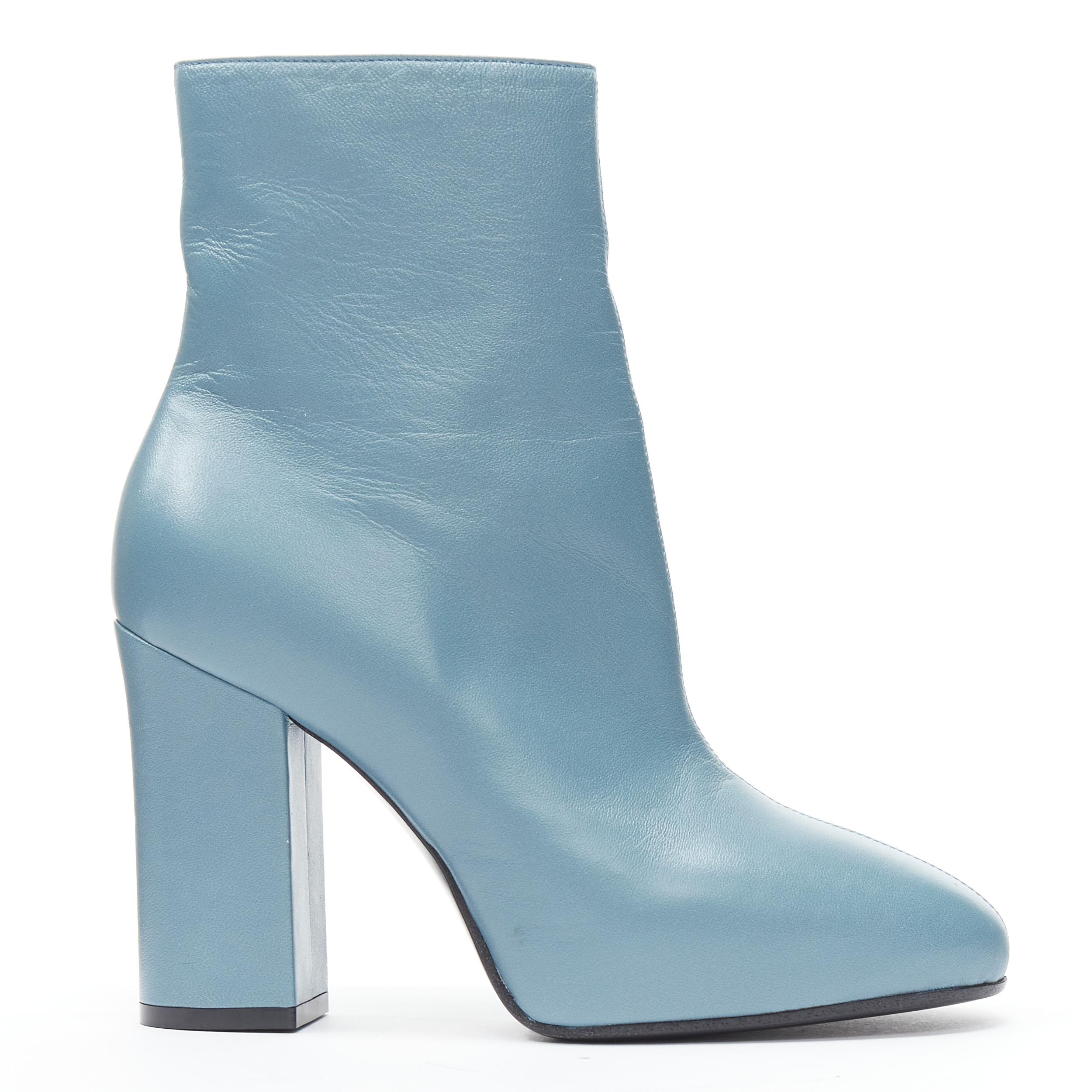 new DRIES VAN NOTEN Runway slate blue rose print block heel ankle boot EU38 
Reference: TGAS/B01306 
Brand: Dries Van Noten 
Designer: Dries Van Noten 
Material: Leather 
Pattern: Solid 
Extra Detail: Asymmetric boots. Dirty blue leather upper.