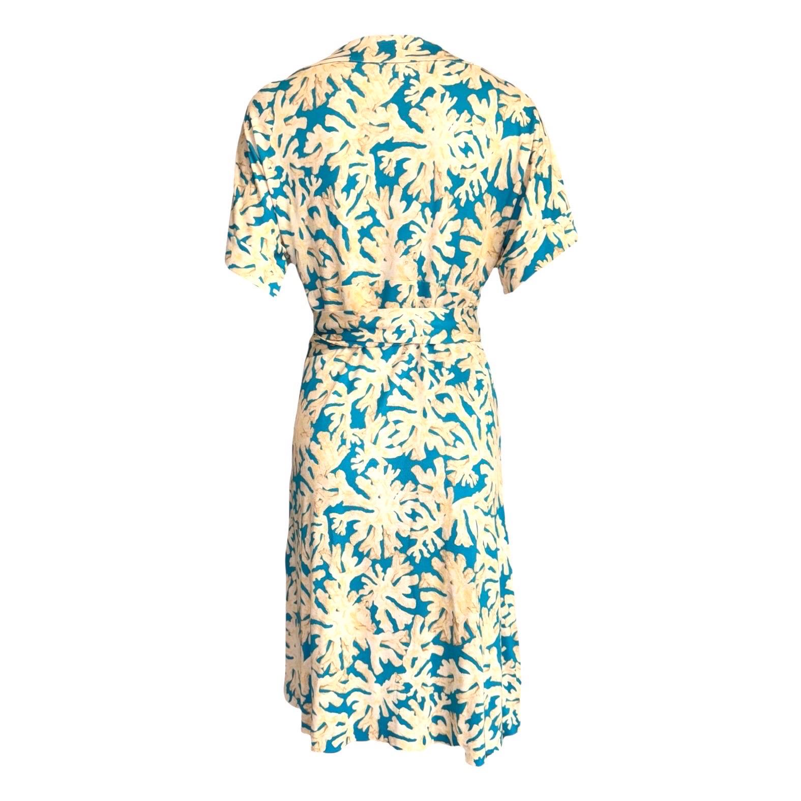 Stunning Diane von Furstenberg Signature Print Dress
Wonderful coral print with turquoise background
Mid length
Wrap style, adjustable
Finest silk jersey
100% pure silk
Rare piece. Impossible to find!
New, unworn
Size 10 US

Forty years after