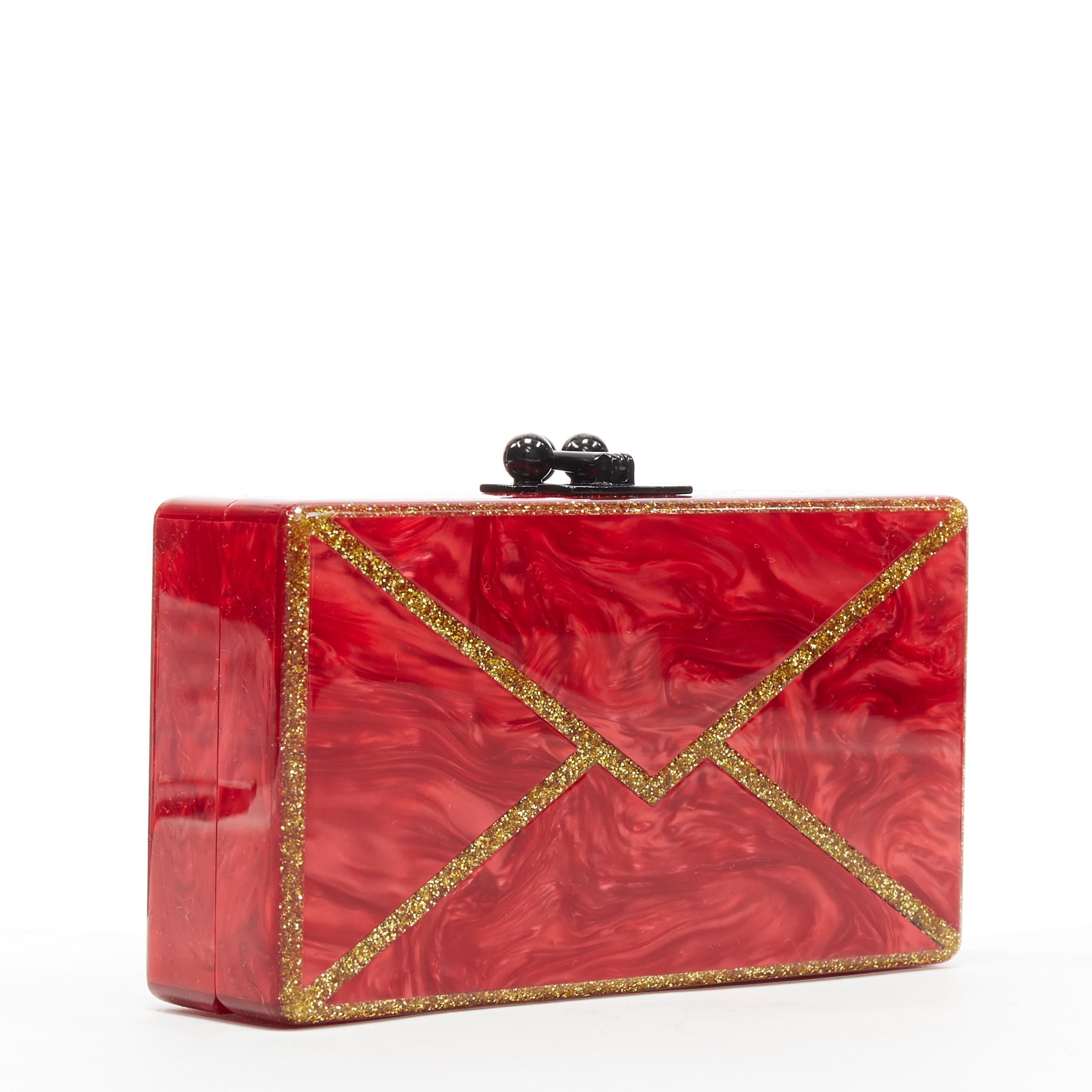 new EDIE PARKER Jean red gold glitter envelope rectangular box clutch bag
Brand: Edie Parker
Designer: Edie Parker
Model Name / Style: Box clutch
Material: Acrylic
Color: Red
Pattern: Solid
Closure: Clasp
Extra Detail:

CONDITION: 
Condition: New