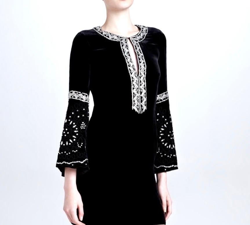 In plush black velvet, Emilio Pucci's embroidered dress is a romantic invitation to the cooler season.

A standout piece for evening events, this sparkling crystal-embellished style hits high on the thigh with flared sleeves adding extra drama.