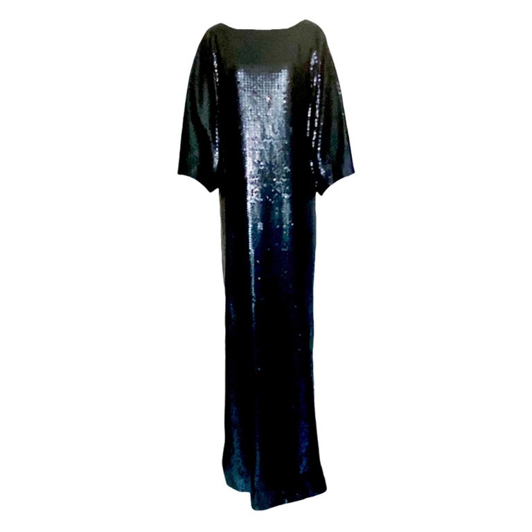 Stunning Emilio Pucci Evening Gown
Pièce unique - you will not see anybody else wearing this fantastic gown
Rich silk fully embroidered with black sequins
Lined with Pucci signature print silk
Slits on side
Batwing sleeves
Deep back decollete
Heavy