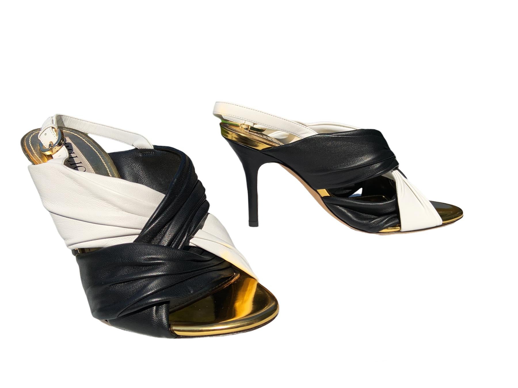 New Emilio Pucci Leather Slingback Sandals
Italian size 36 - US 6
Two Tone Classic White & Black Colors, Gathered Soft Leather, Gold Tone Leather Lining, Gold Tone Hardware, Leather Sole.
Black Leather Covered Heel Height - 3.5 inches
Made in