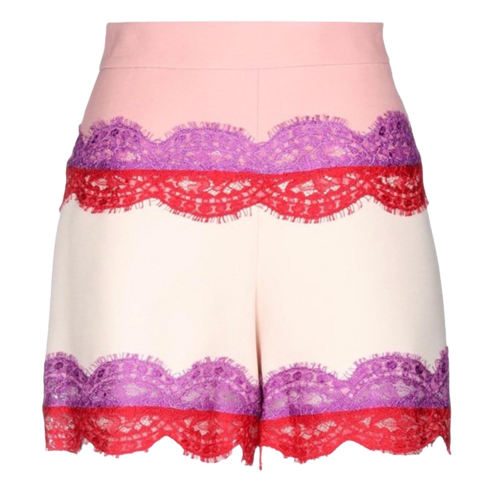 Wonderful shorts by Emilio Pucci
Blush & offwhite colors
Purple & Red lace trimmings
Closes on side with hidden zip
Size 44
Retails for 789$ plus taxes
Dry clean only
Made in Italy