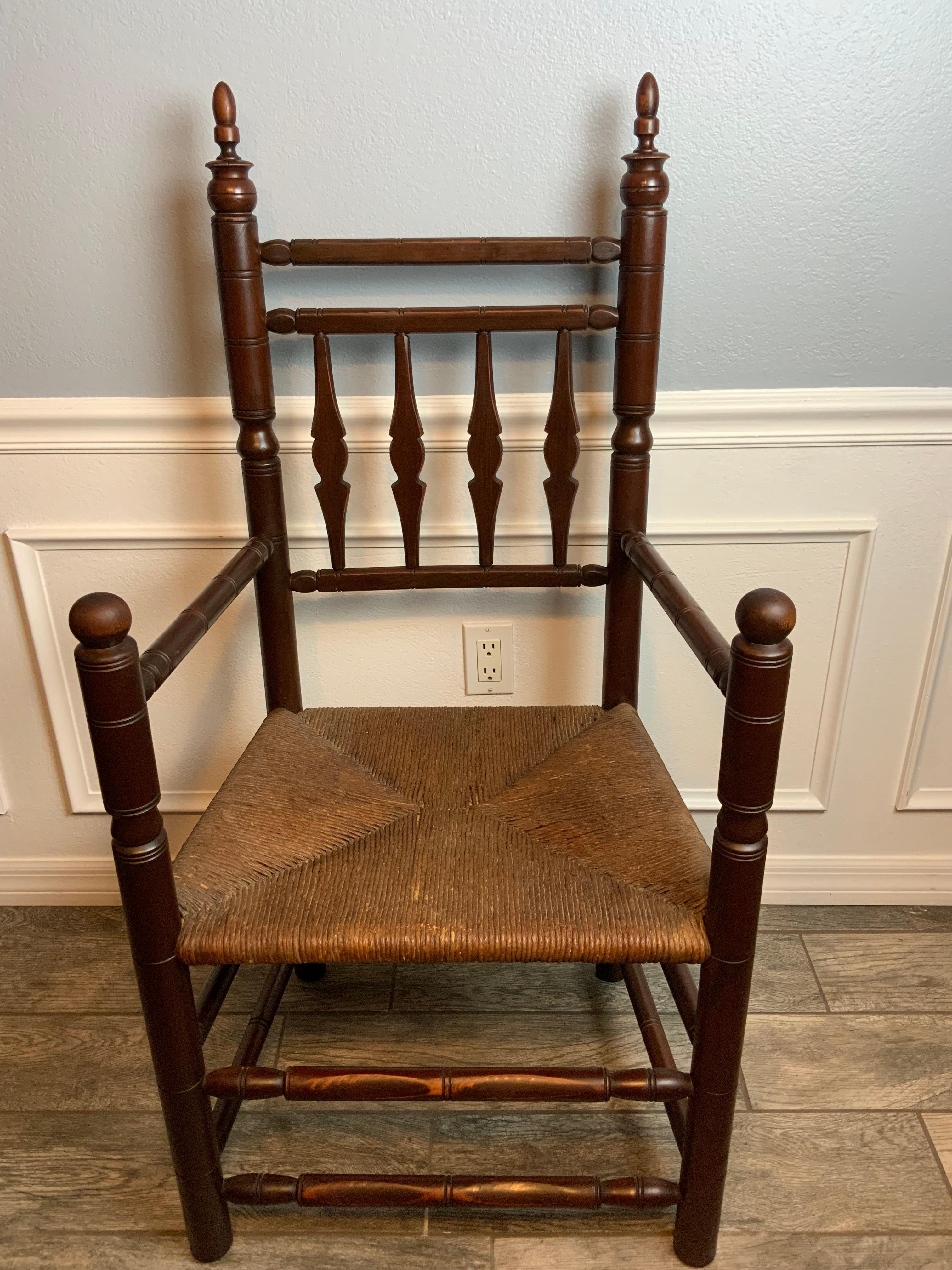 A very classic form of a 17th century New England Style Carver chair that looks to be made in the late 1800’s or early 1900’s.  This very well crafted chair is made of Maple and ash and has an old rush seat that is in very good condition considering
