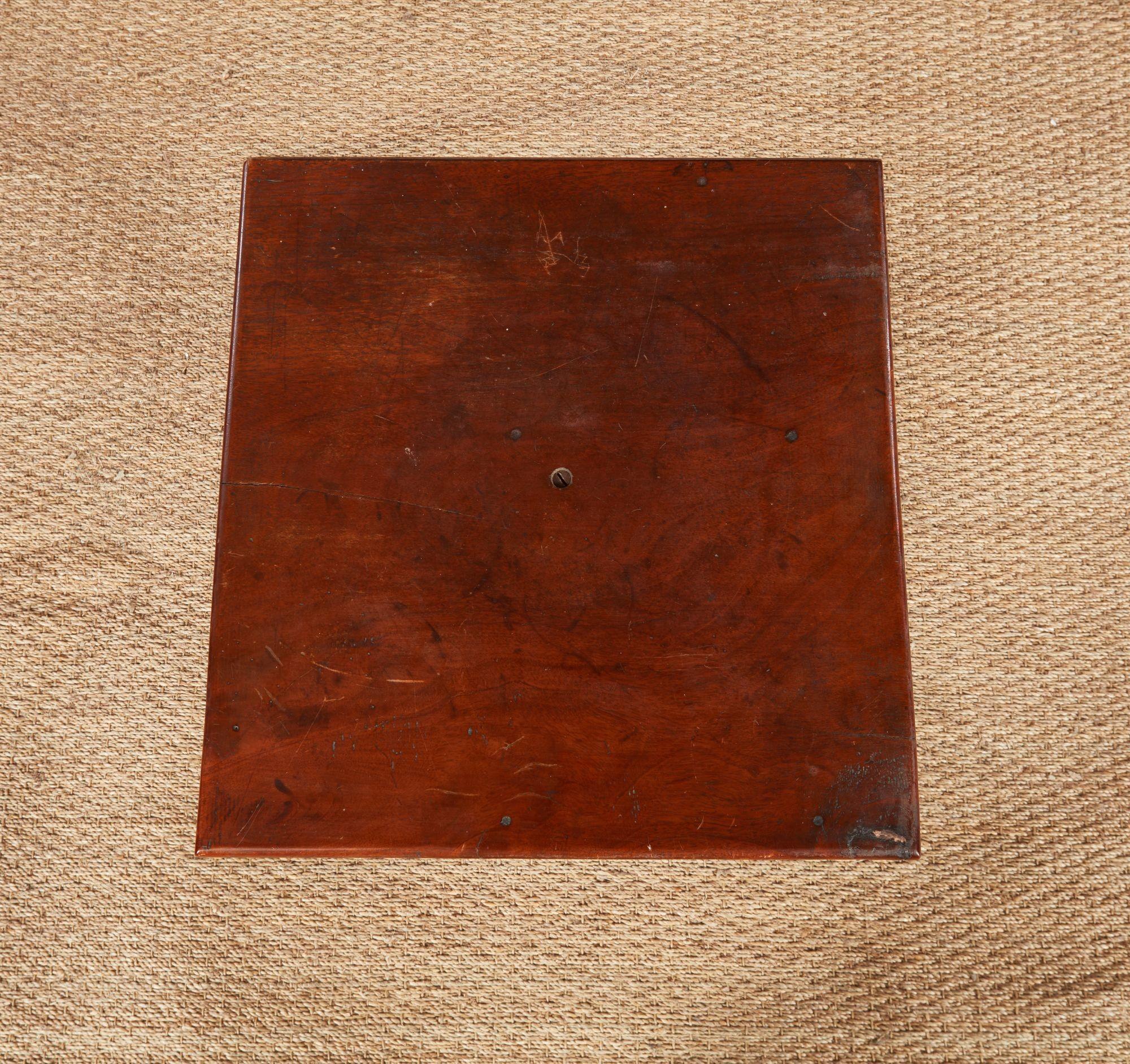 18th century New England cherry wood candlestand with old mellow surface, the square top now fixed in place over turned urn shaft and standing on cabriole legs ending in elongated ball and claw (sometimes called egg and claw) feet.
Table: 29