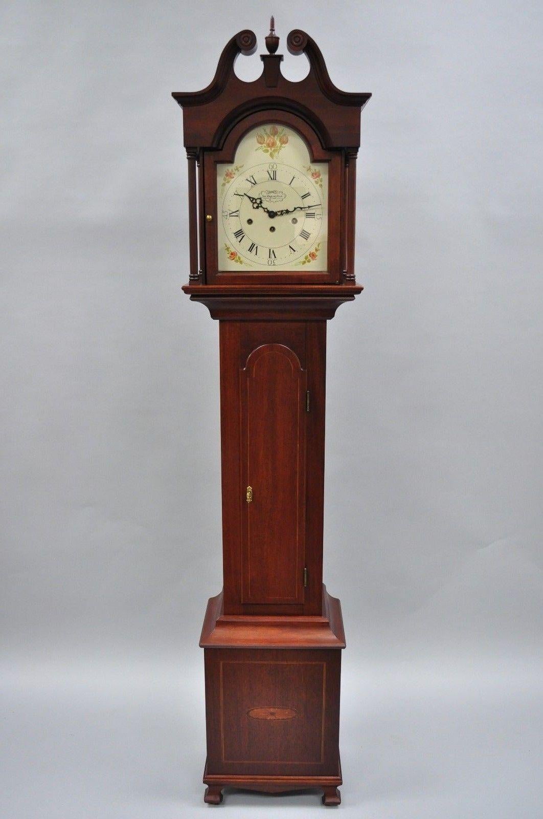 Vintage New England Clock Co. Mahogany inlaid Grandmother Clock. Item features working condition, wood construction, working lock and key, and quality American craftsmanship, circa 1983. Measurements: 70