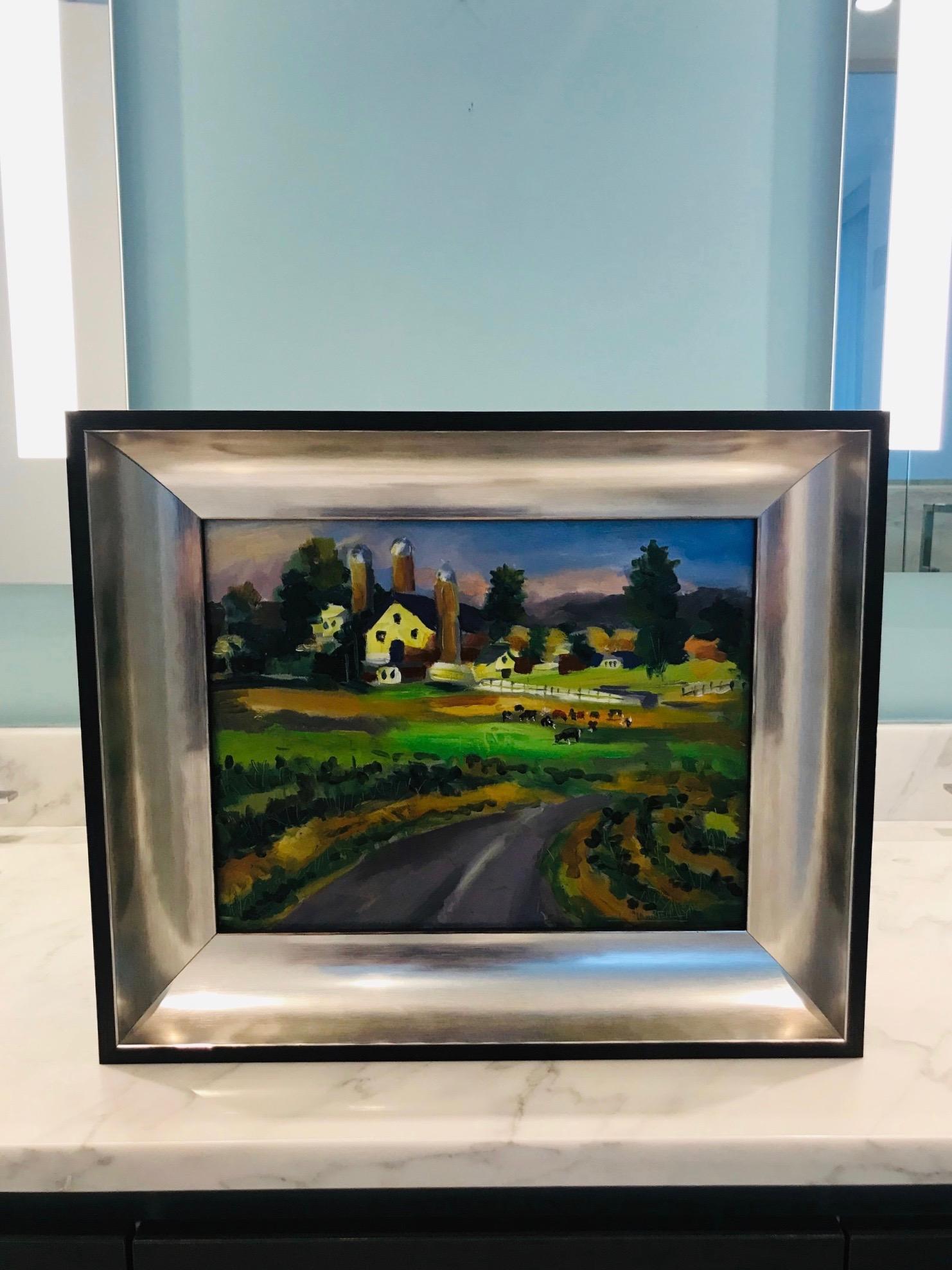 Outstanding contemporary impressionist landscape painting depicting a grassy road and acres of pasture with grazing cows, and a farm and hills in the background. Oil on board in custom shadow box frame with ebonized wood exterior and molded interior