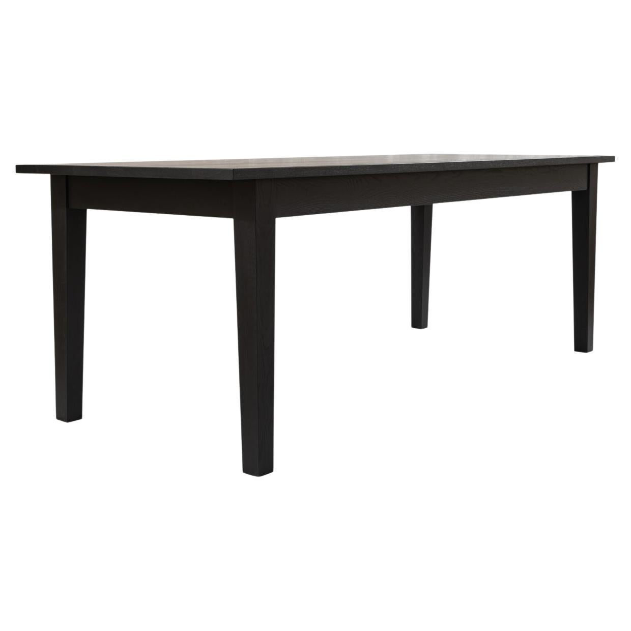 Our modern take on a classic shaker farm table. The New England Farm Table features slim rails, neat but bold reveals, and a chunky tapered leg. When paired with sustainably harvested hardwoods, the crisp contrast yields a classic design with a