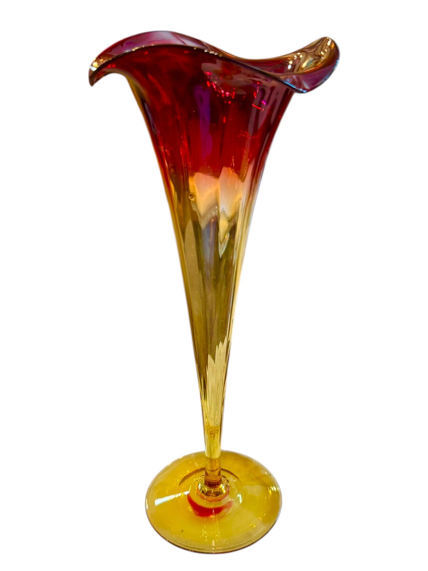 This exquisite Amberina Tulip Vase by the New England Glass Company is a shining example of Victorian-era craftsmanship and beauty. Hand-blown in the late 1800s, the vase showcases the signature Amberina color gradient, transitioning from a deep