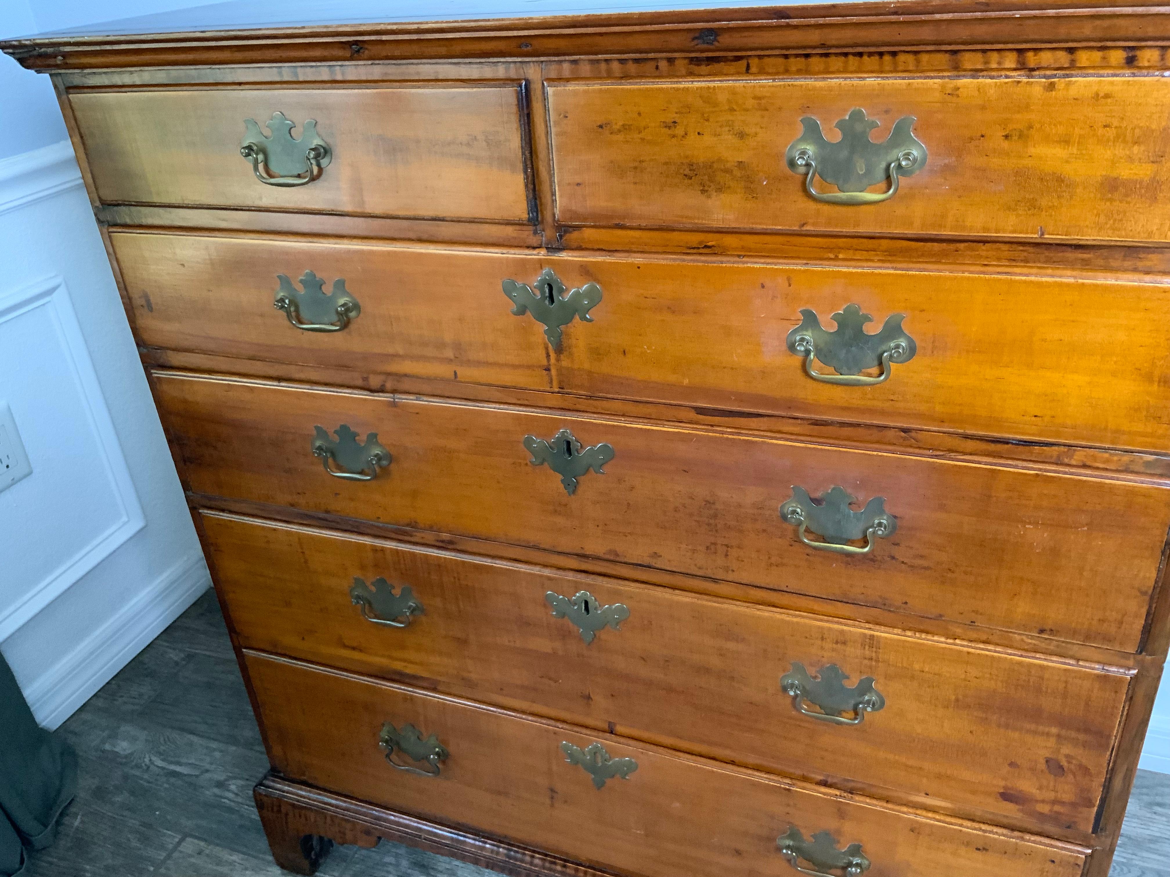 Very nice late 18th century Maple tall chest with Chestnut secondary wood. Nicely dovetailed case work and two over four molded graduated drawers over tall bracket feet. Excellent color and patina to the old refinished surface.

Condition : Minor