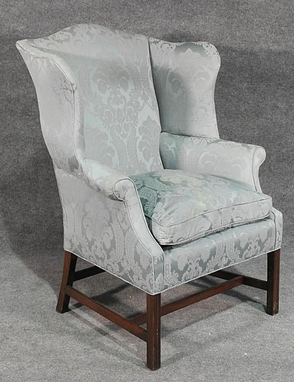 This is a beautiful Hepplewhite chair of the New England school, circa 1920. The design is unmistakably New England and probably Massachusetts or New Hampshire made or inspired. The damask is a soft blue and may be silk but we are not certain. The