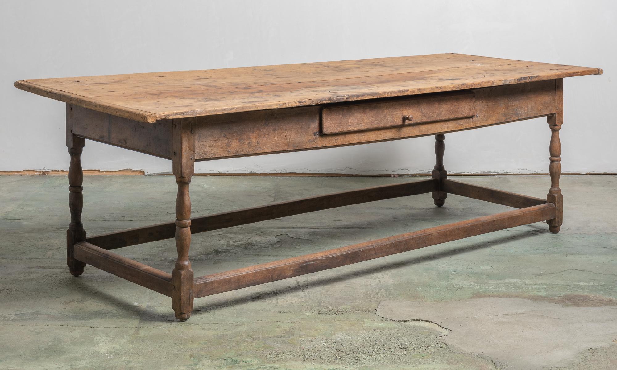 New England Tavern Table, America, circa 1790.

Sturdy oak construction includes a three-plank pine top, hand-turned legs, stretcher supports, and a single pull drawer.

86.25