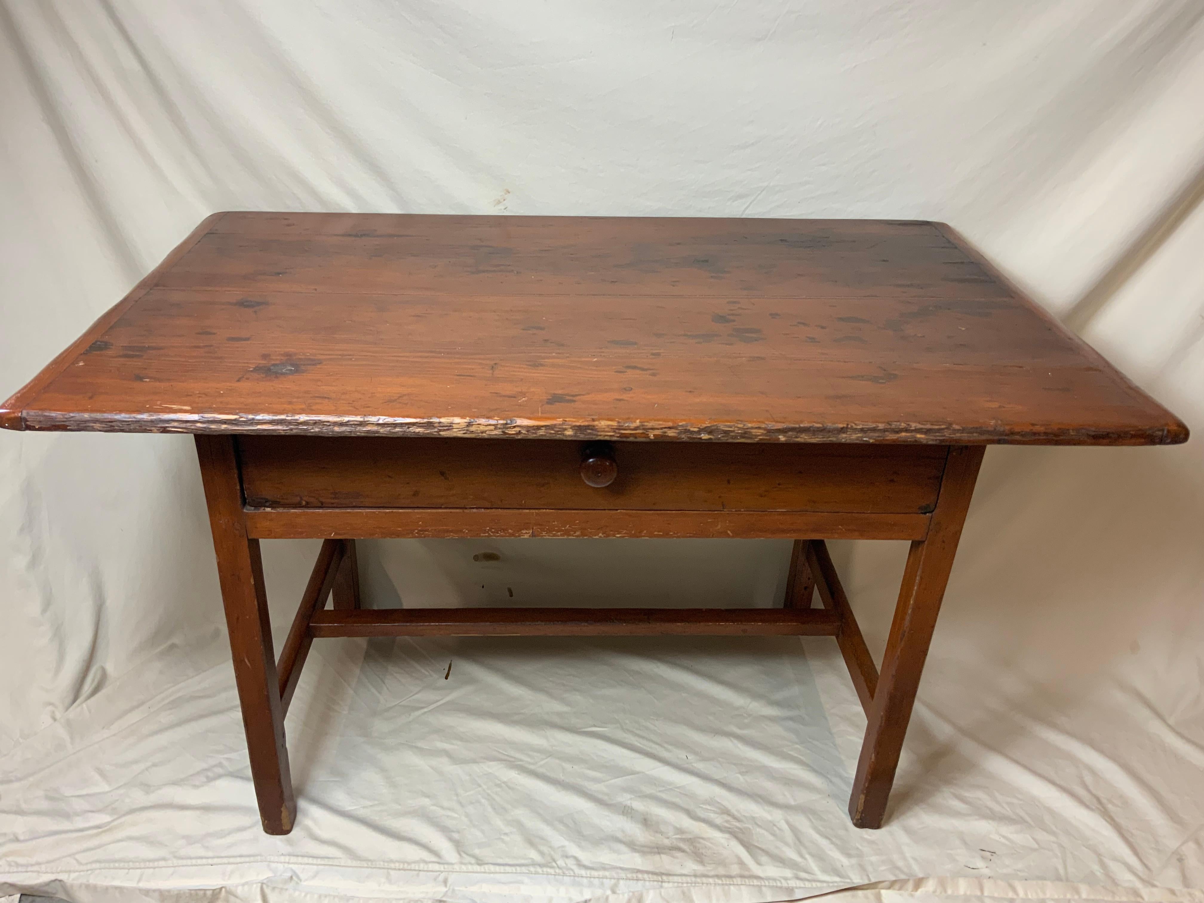 A nice early Pine New England Tavern Table 1780-90.  All pegged construction on an H stretcher base showing old Salmon color and Black paint. Old refinish with a great color and patina.  Please ask for additional shipping quotes.