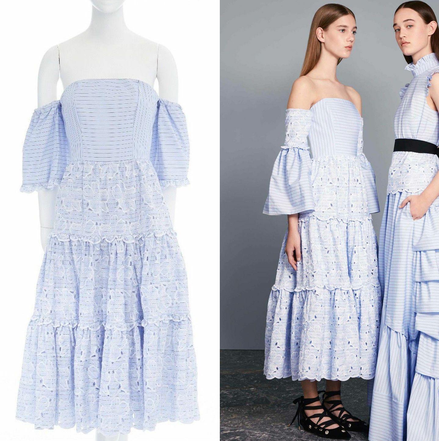 new ERDEM Runway blue striped cotton floral embroidery off shoulder dress US4 S

ERDEM
FROM THE RESORT 2017 COLLECTIONCotton, silk. Light blue stripe. Built in corset. Off shoulder with elasticated arm cuff. Flared sleeve, White floral embroidery