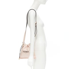 new FENDI beige pink logo print leather drawstring pouch crossbody bag