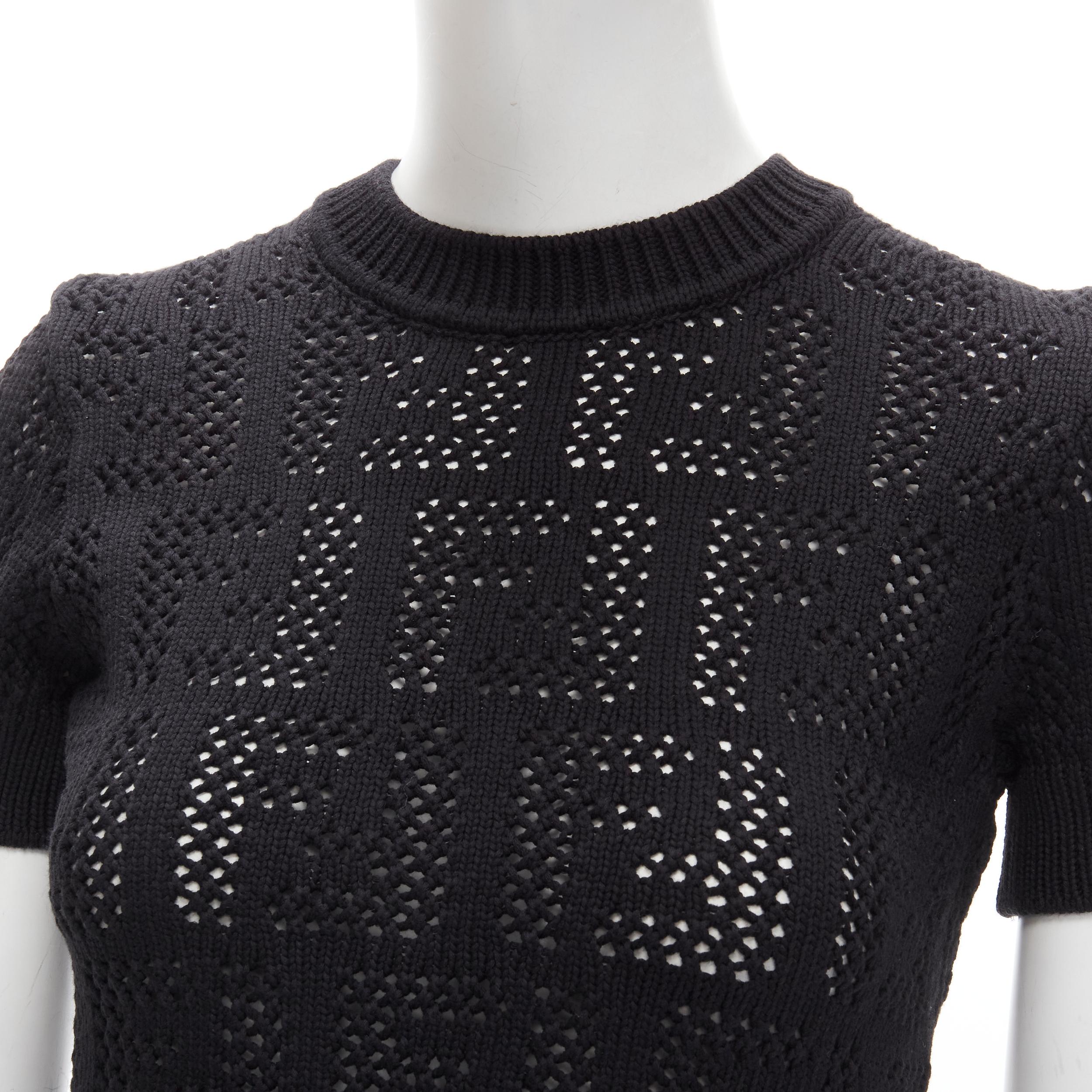new FENDI FF Zucca black cotton knit crochet sweater top IT36 XS.
Brand: Fendi
Collection: FF Zucca 
Extra Detail: FF Monogram crochet knit. Crew neck short sleeve knitted sweater.
Estimated Retail Price: US $1010

CONDITION:
Condition: New with