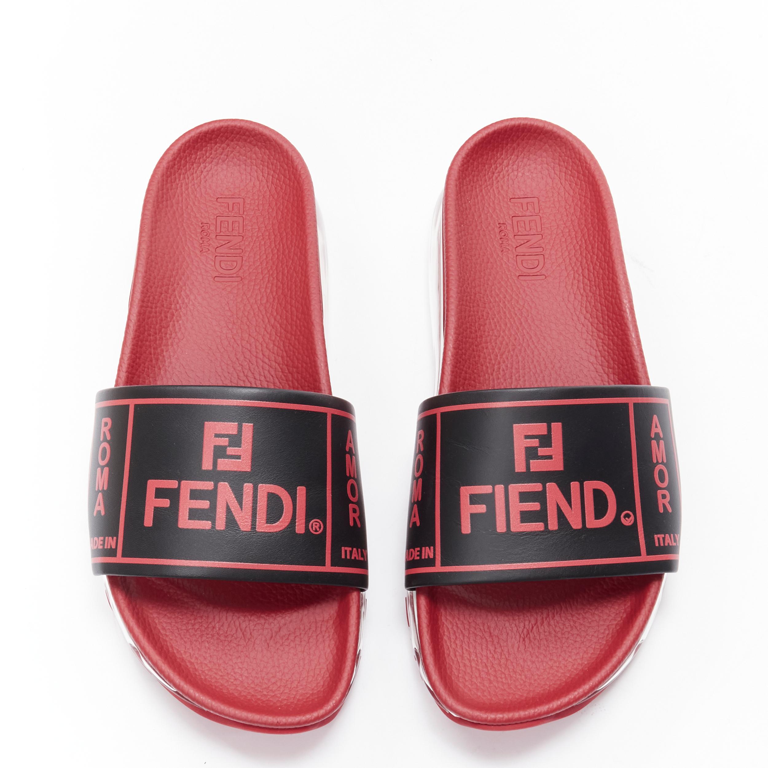 new FENDI Fiend Roma Amor black red leather air sole slides sandals UK9 EU43 
Reference: TGAS/B01607 
Brand: Fendi 
Model: Fiend slides 
Material: Leather 
Color: Red 
Pattern: Solid 
Extra Detail: Fendi logo print. Leather strap. Pebble leather