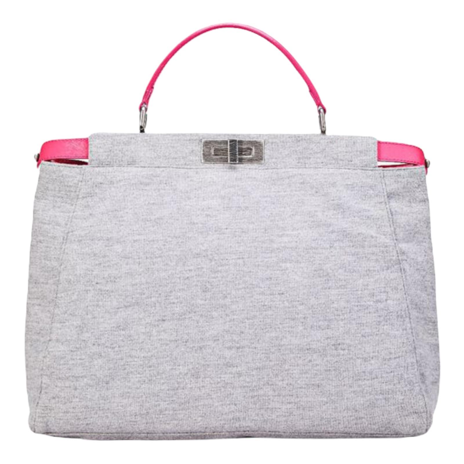 Rare FENDI Peekaboo shoulder bag in a very limited edition - only 3 pieces per country.

Details:

• Light grey fabric with hot pink leather lining
• Brushed silver-tone hardware
• Top handle with rings
• Adjustable, removable shoulder strap

• 2