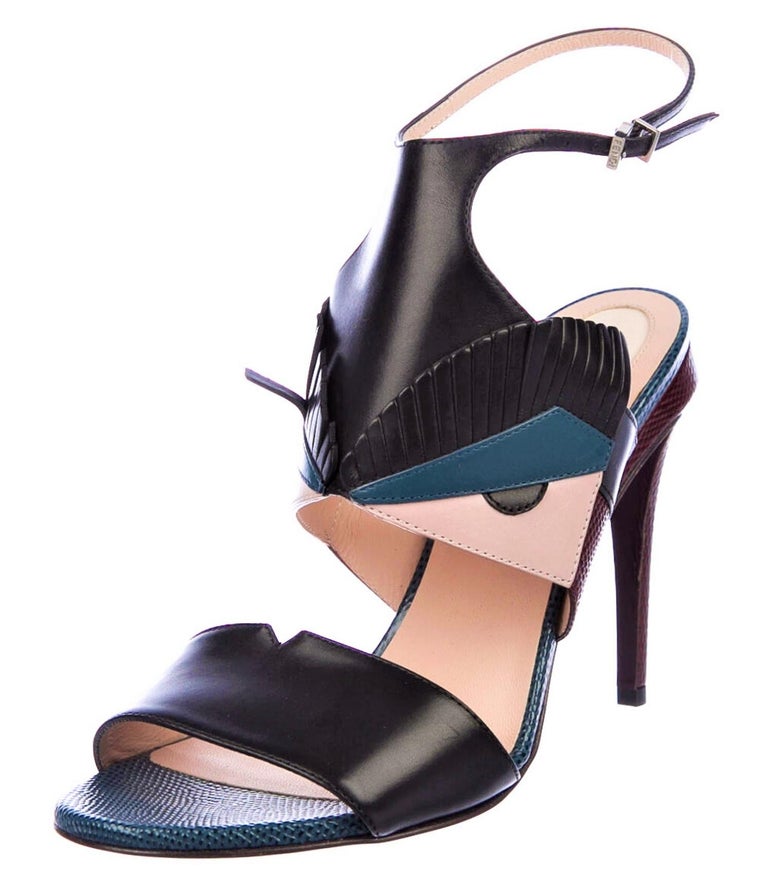 Fendi Karl Lagerfeld
Monster Bugs Leather Heels
* Retail $1375
* Size 38 
* Silver Adjustable Strap
Monster Bugs
*Blue Black Pink-Cream Leather
* Leather Insole
Heel 4.25