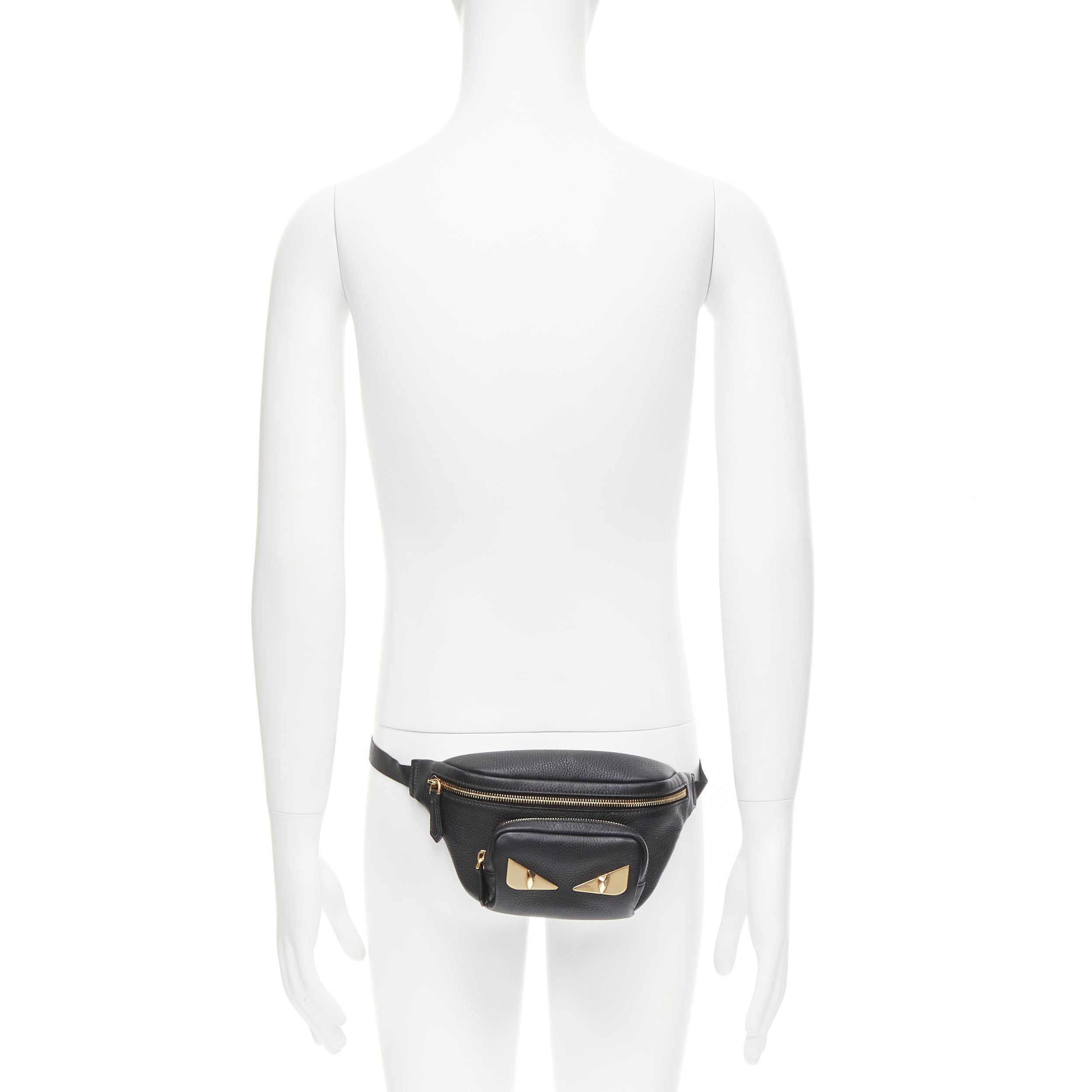new FENDI Monster Eye black leather gold Eye plate crossbody small belt bag 
Reference: TGAS/C00735 
Brand: Fendi 
Model: 7VA446 A75R F0KUR 15 
Collection: Monster 
Material: Leather 
Color: Black 
Pattern: Solid 
Closure: Zip 
Extra Detail: Black
